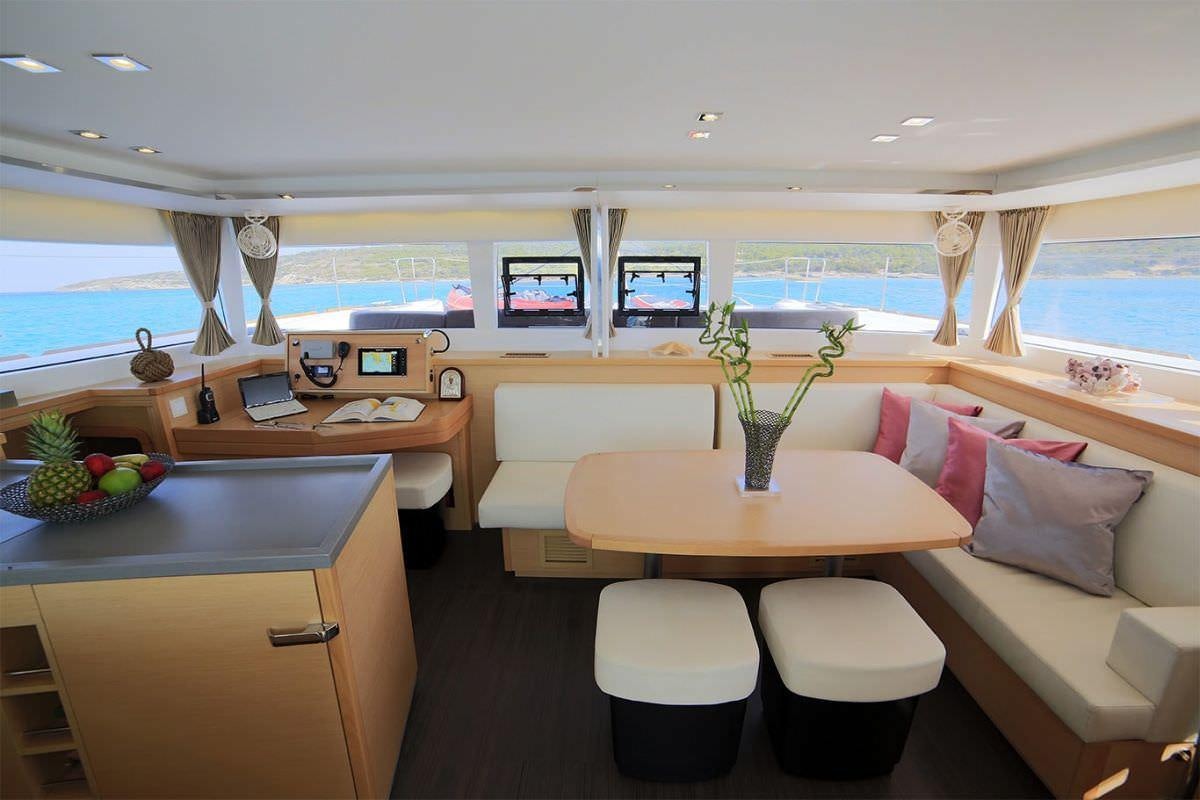 a room with a desk and a bed aboard DANIELA II Yacht for Charter