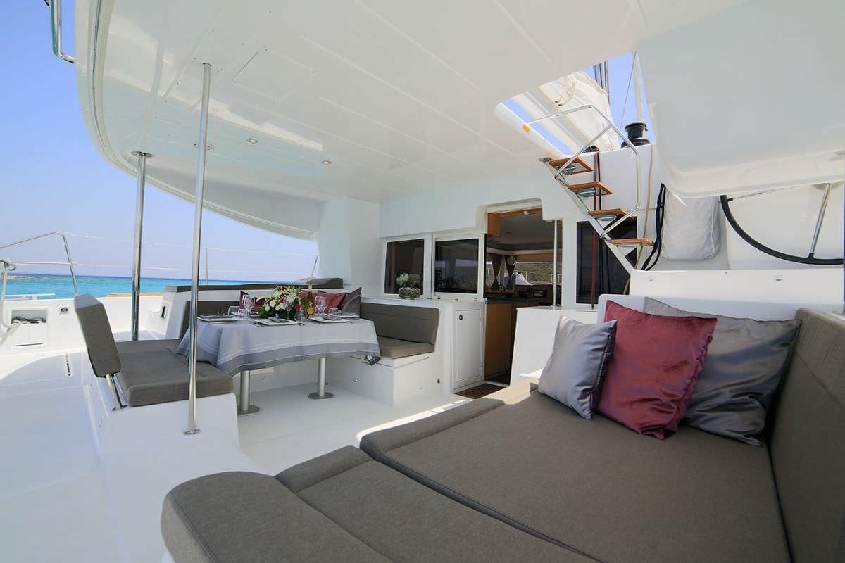 a bedroom with a bed and a desk aboard DANIELA II Yacht for Charter