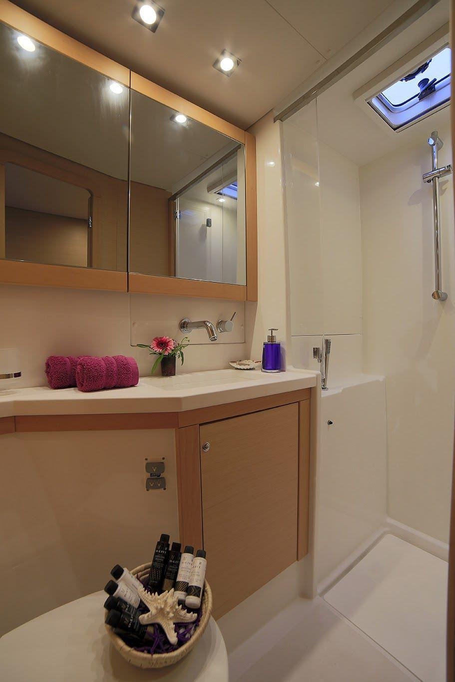a bathroom with a large mirror aboard DANIELA II Yacht for Charter