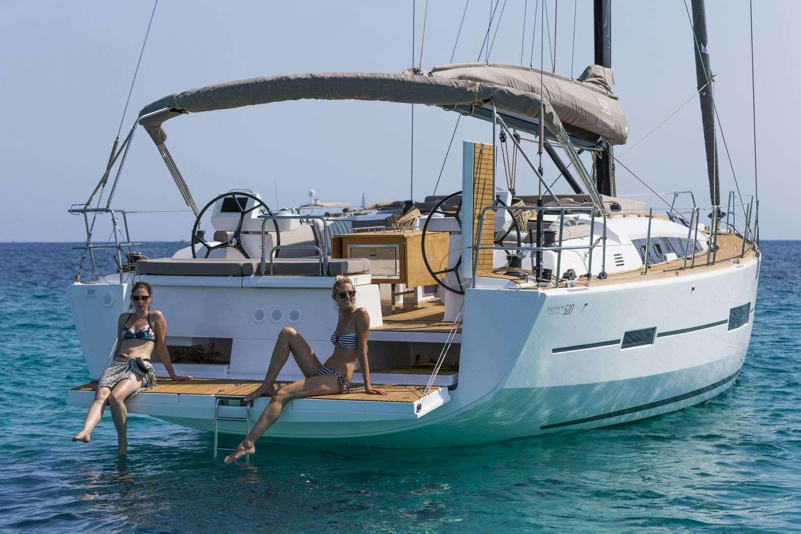 a group of people jumping off a boat aboard Euribia Yacht for Charter