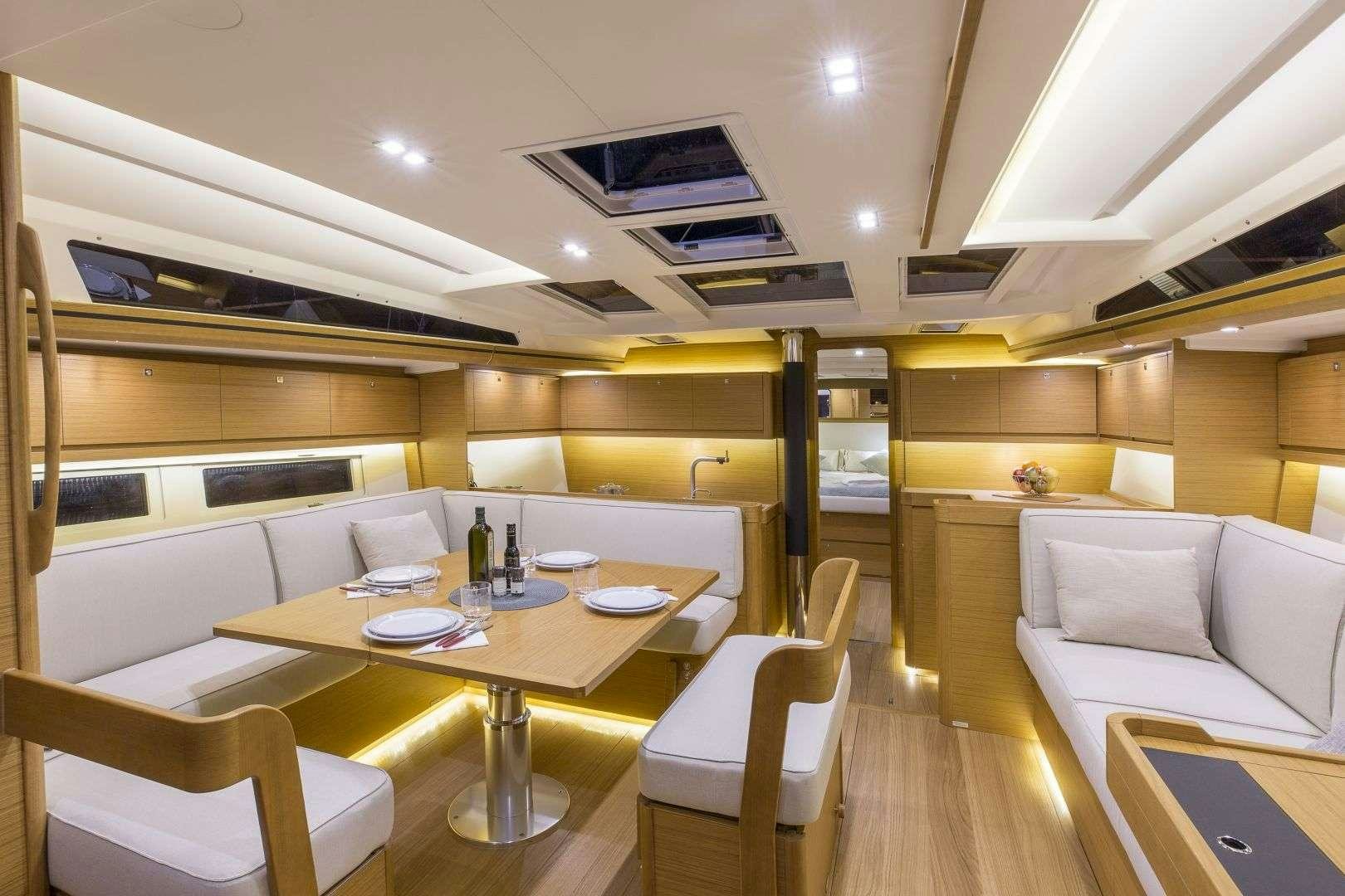 a room with a table and chairs aboard Euribia Yacht for Charter