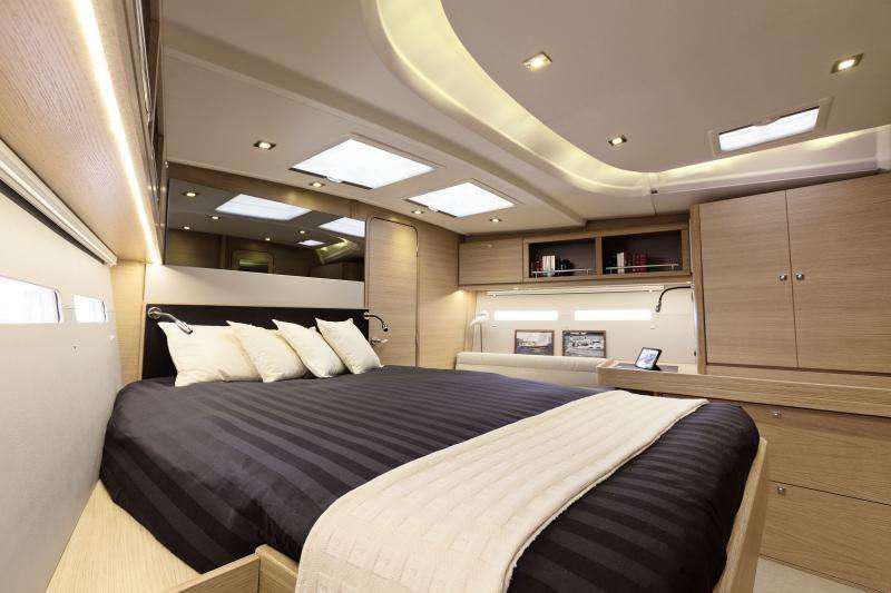 a bedroom with a bed aboard Euribia Yacht for Charter