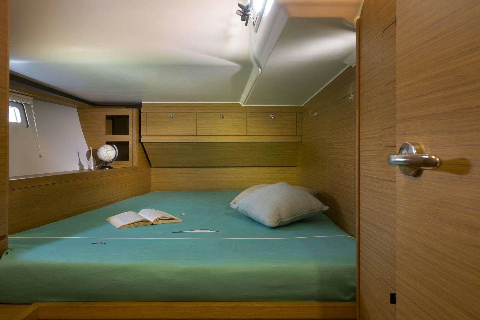 a bed in a room aboard Euribia Yacht for Charter