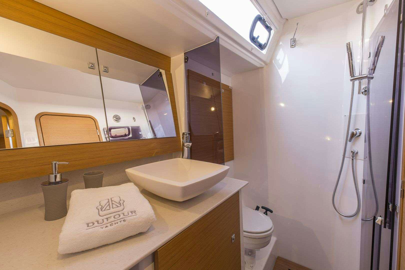 a bathroom with a sink and a toilet aboard Euribia Yacht for Charter