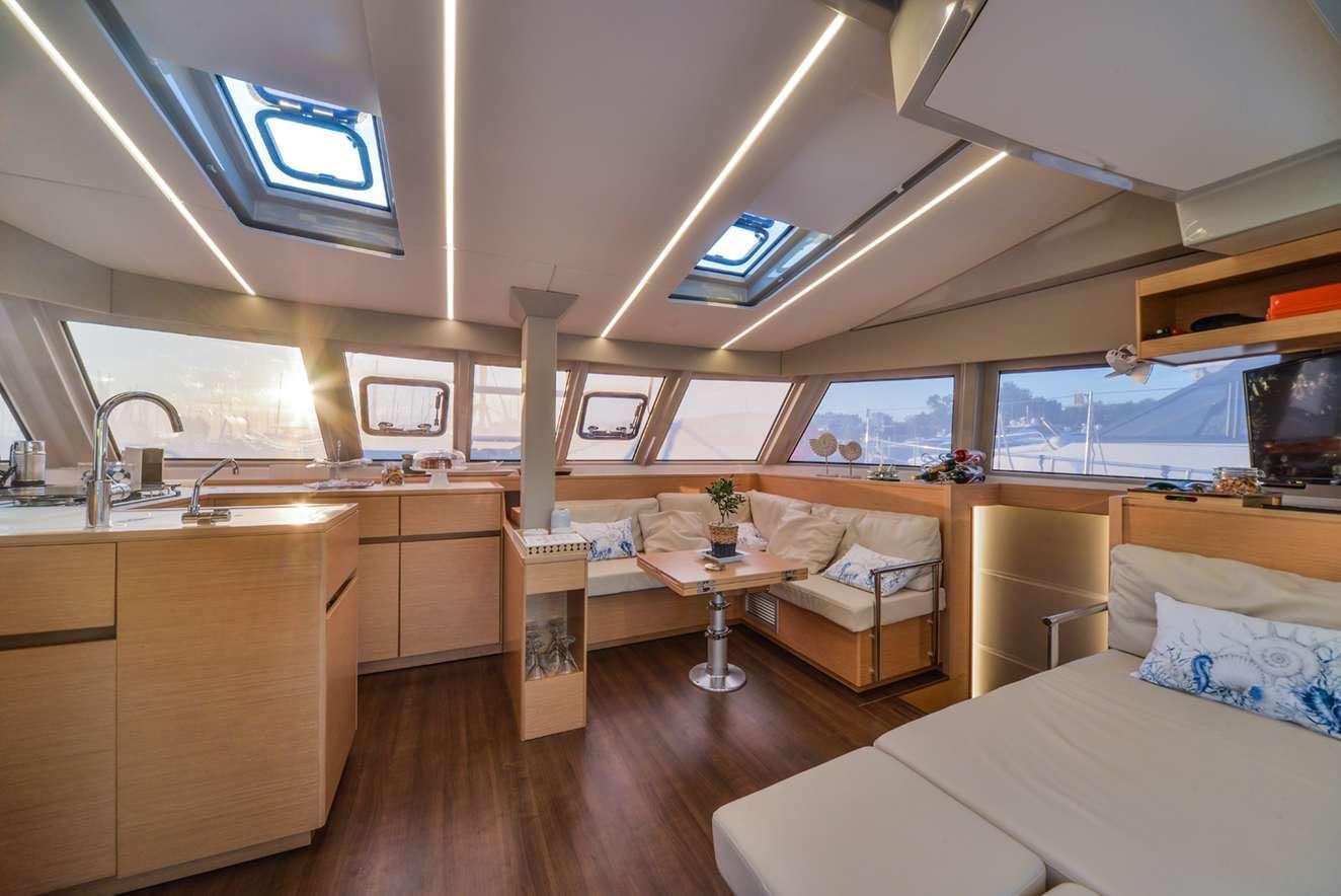 a room with a bed and a desk aboard ODYSSEY Yacht for Charter