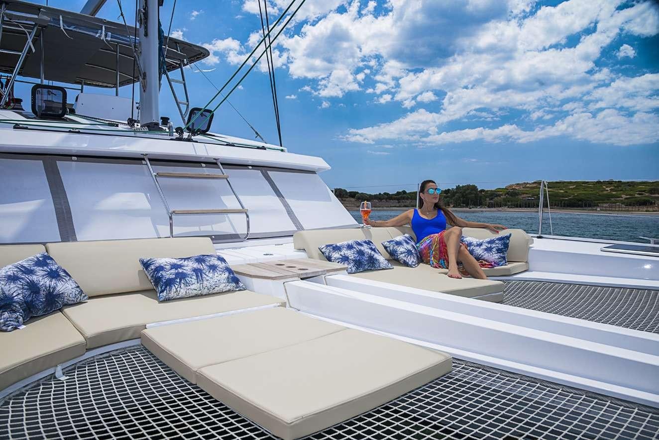 a person sitting on a boat aboard ODYSSEY Yacht for Charter