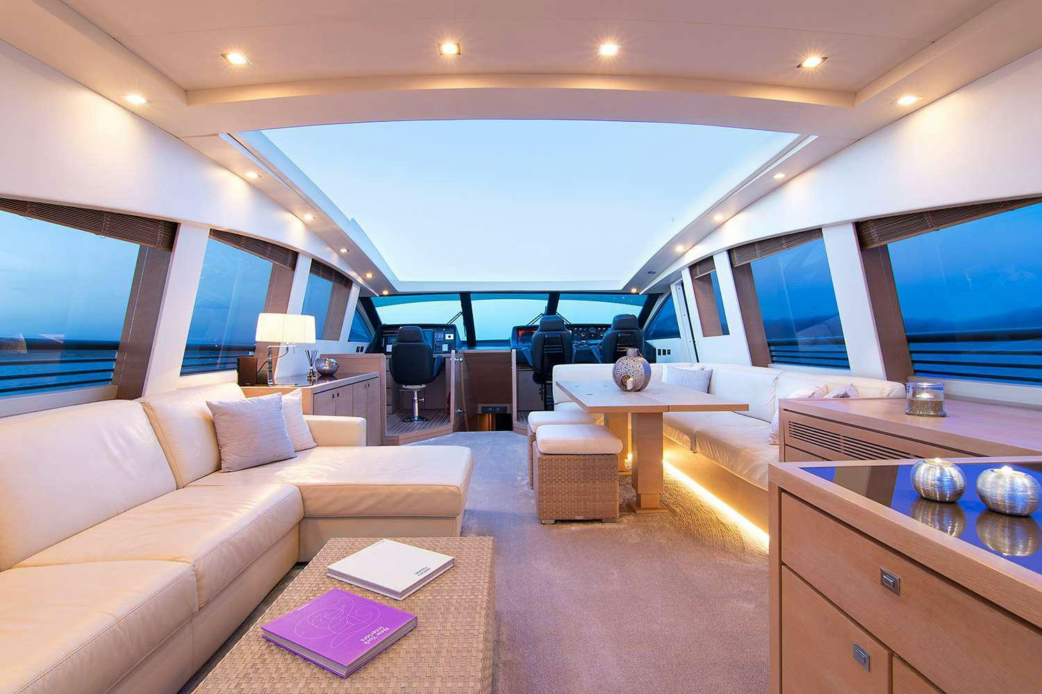 a living room with a large window aboard SUN ANEMOS Yacht for Charter