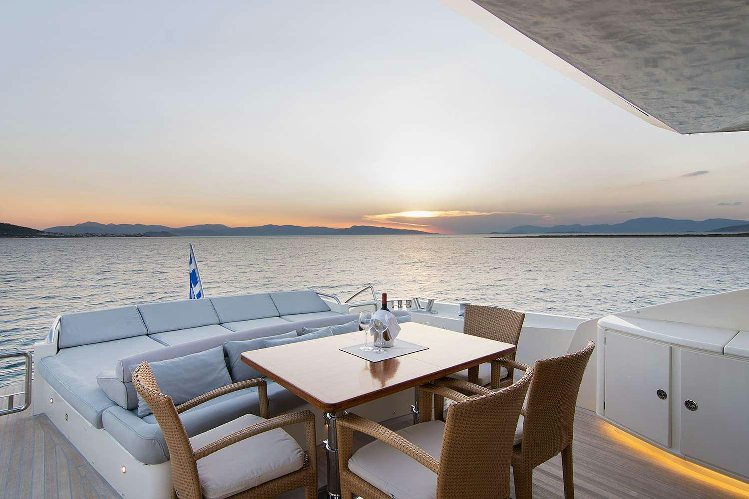 a table and chairs on a boat aboard SUN ANEMOS Yacht for Charter