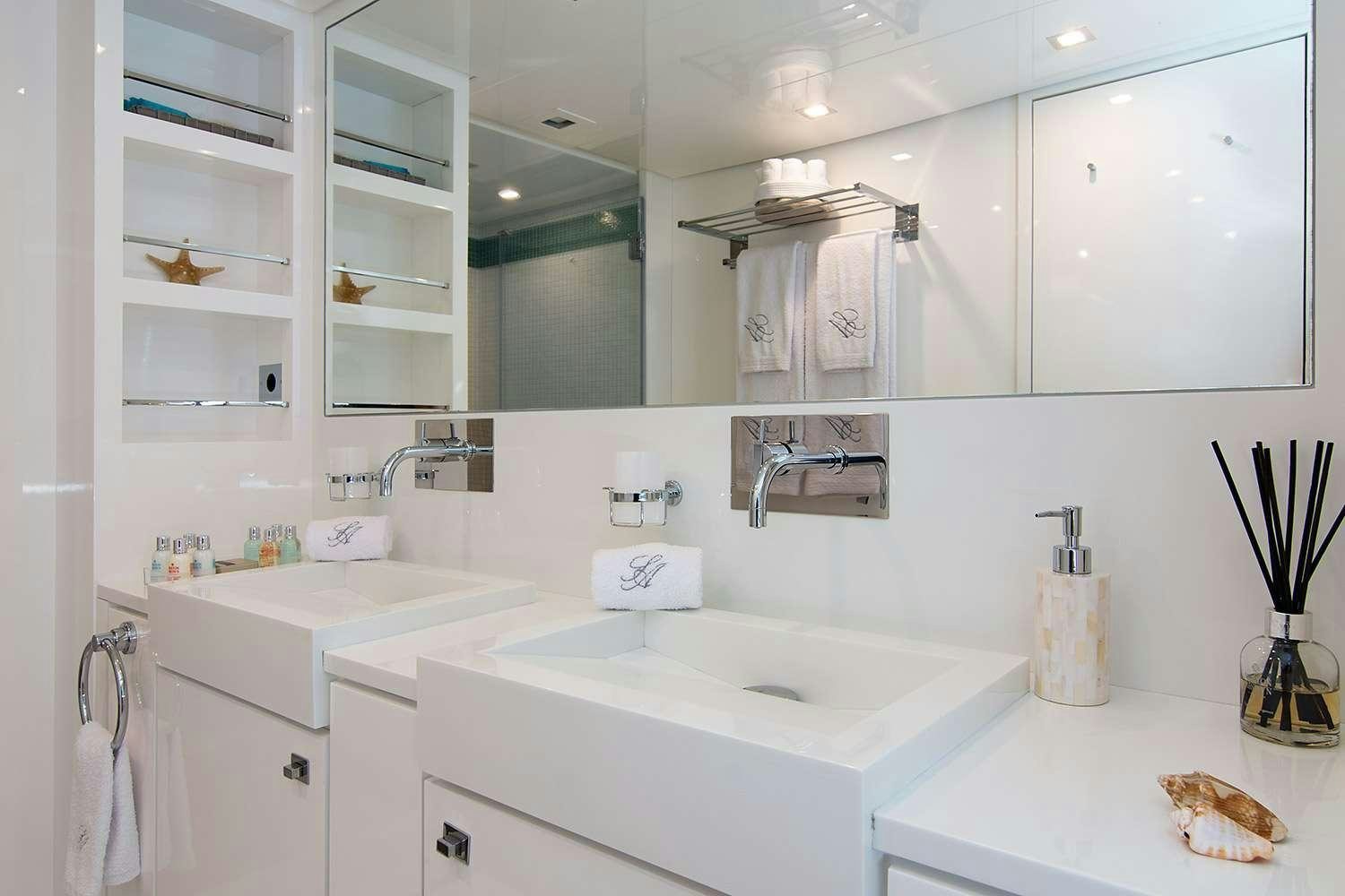 a bathroom with a large mirror aboard SUN ANEMOS Yacht for Charter