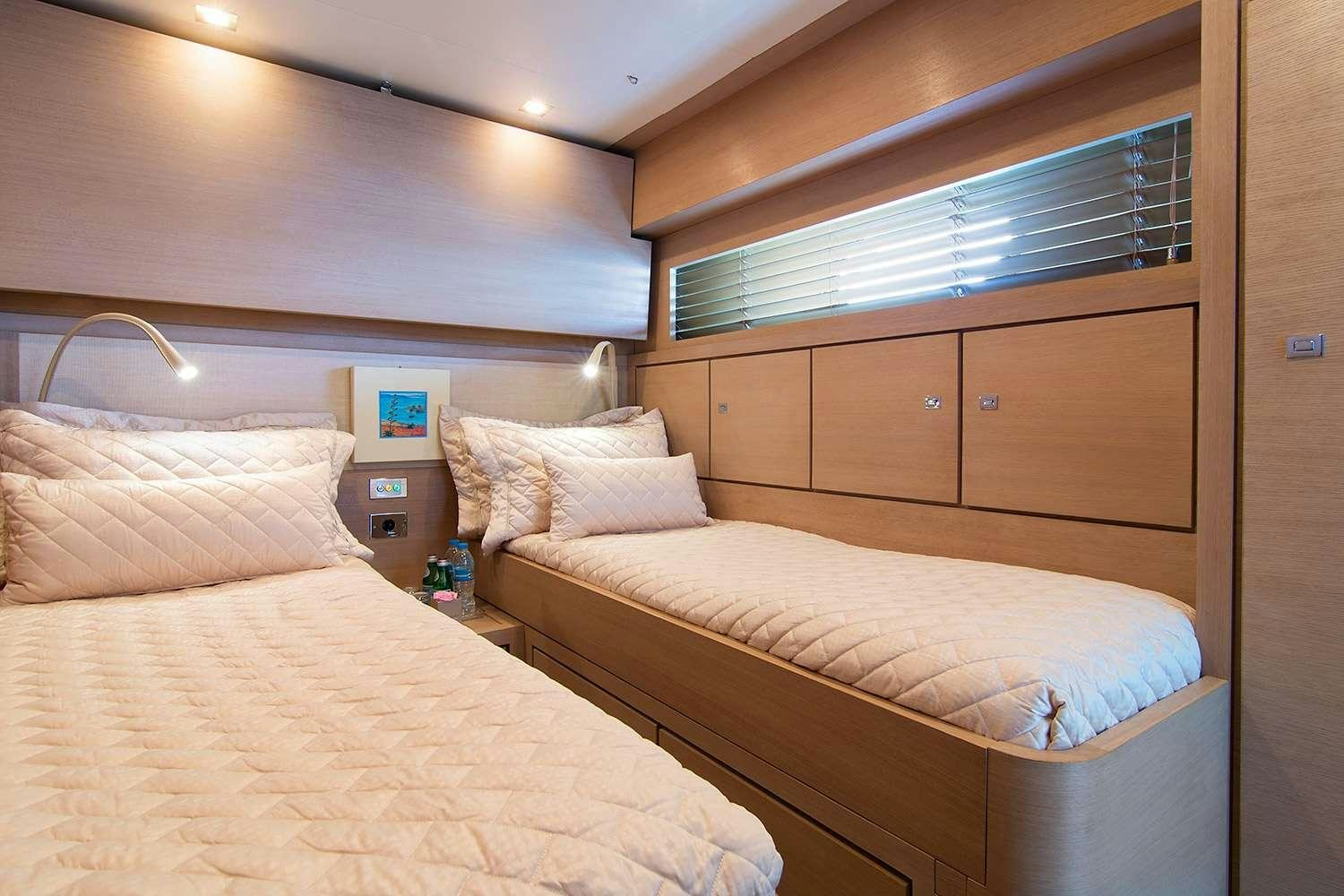 a room with two beds aboard SUN ANEMOS Yacht for Charter