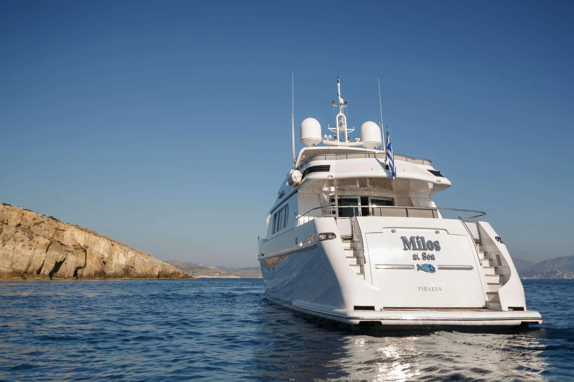 a white boat in the water aboard MILOS AT SEA Yacht for Charter