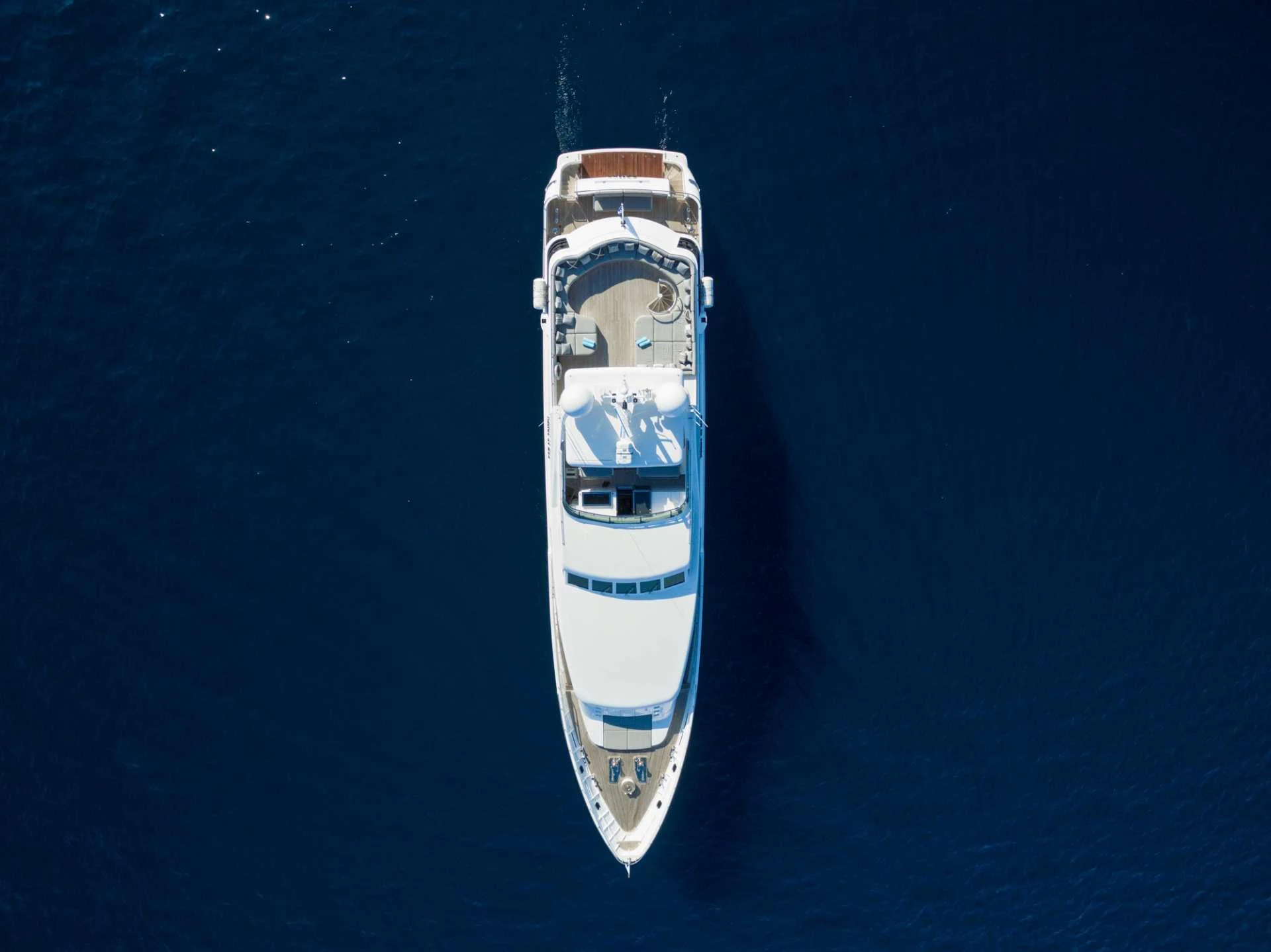 a white and blue boat aboard MILOS AT SEA Yacht for Charter