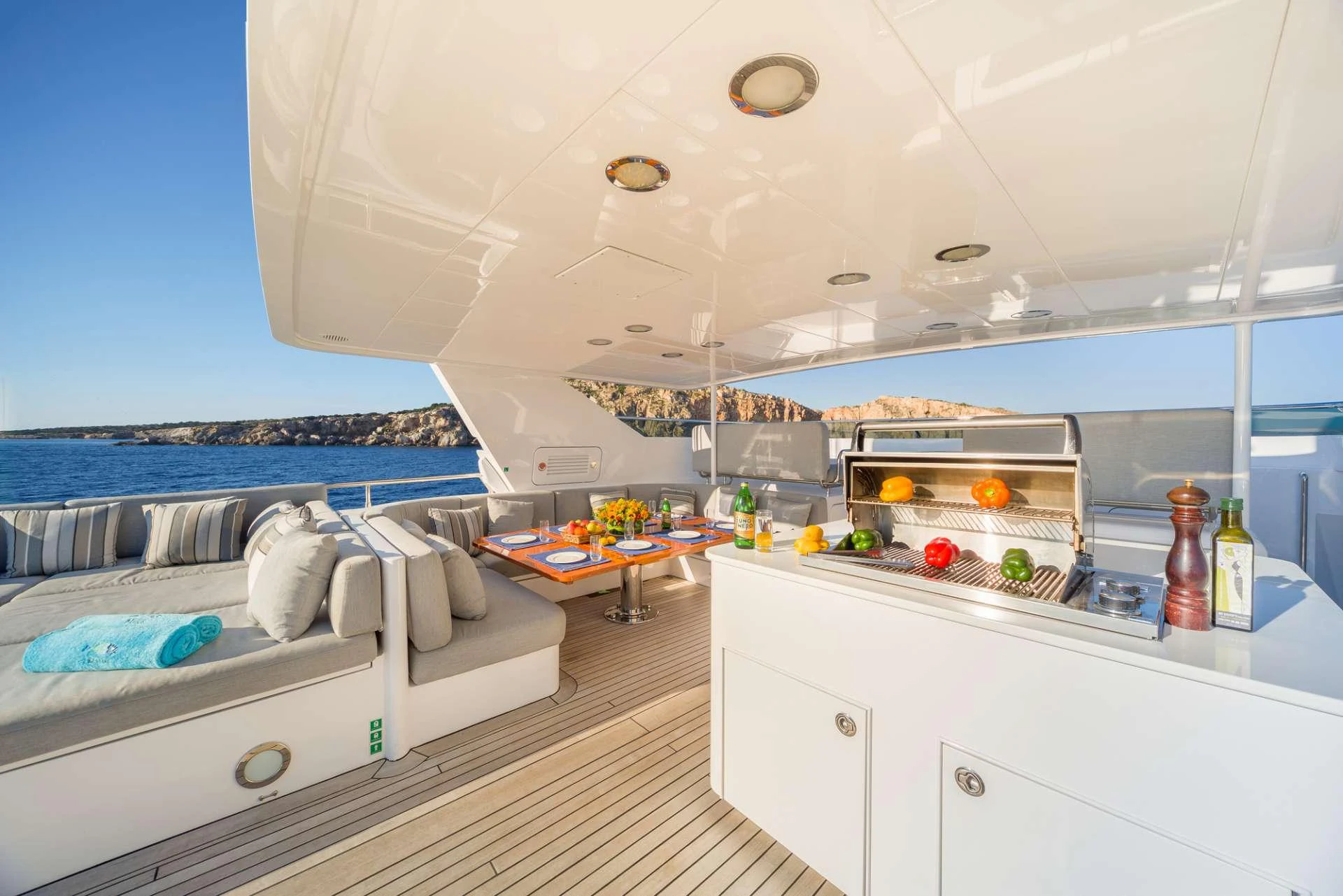 a room with a bed and a table aboard MILOS AT SEA Yacht for Charter