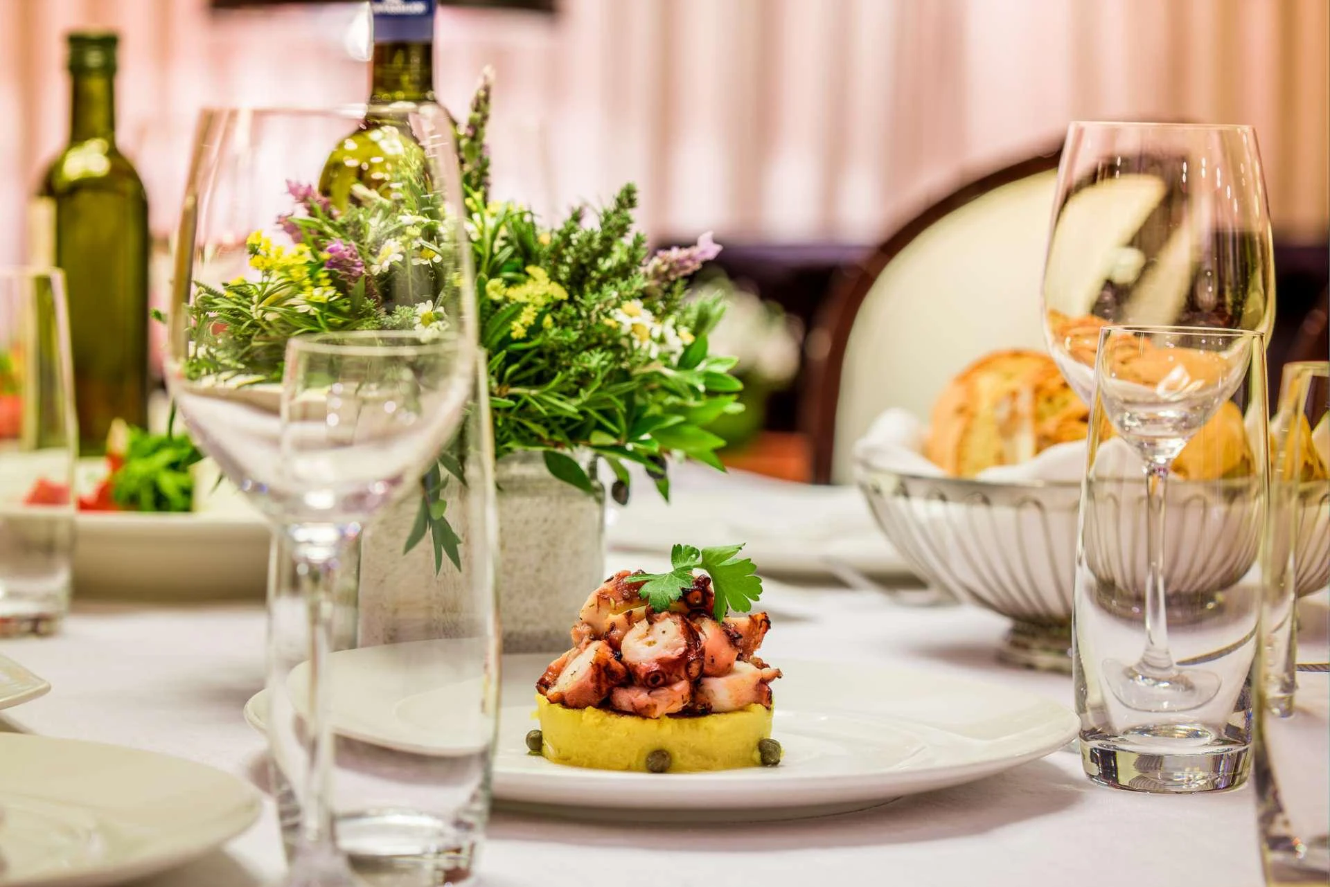 a table with food and wine aboard MILOS AT SEA Yacht for Charter