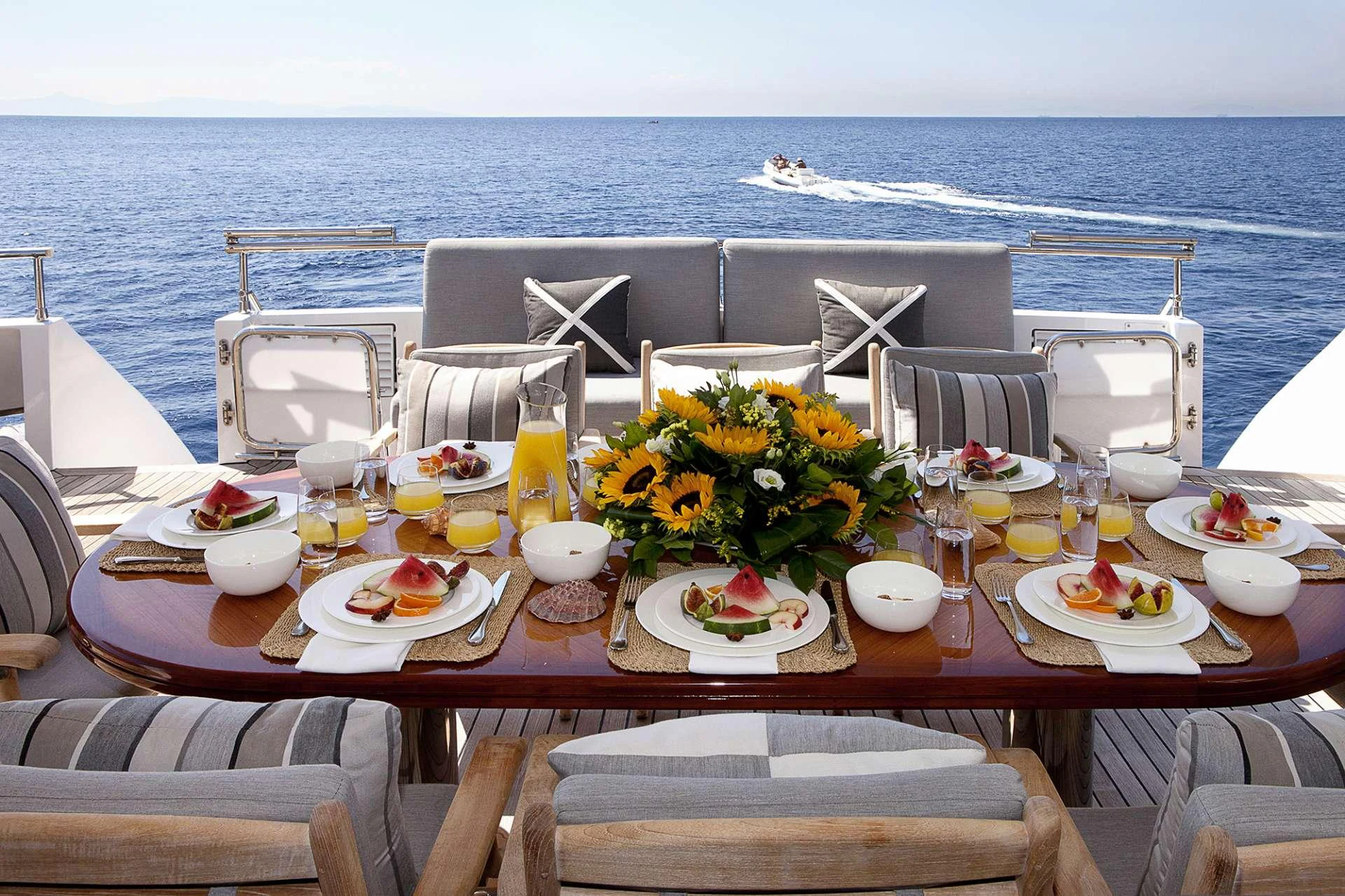 a table set for a meal on a boat aboard MILOS AT SEA Yacht for Charter