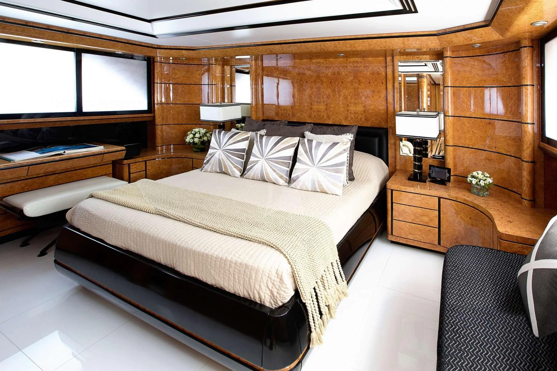 a bedroom with a bed and a desk aboard MILOS AT SEA Yacht for Charter