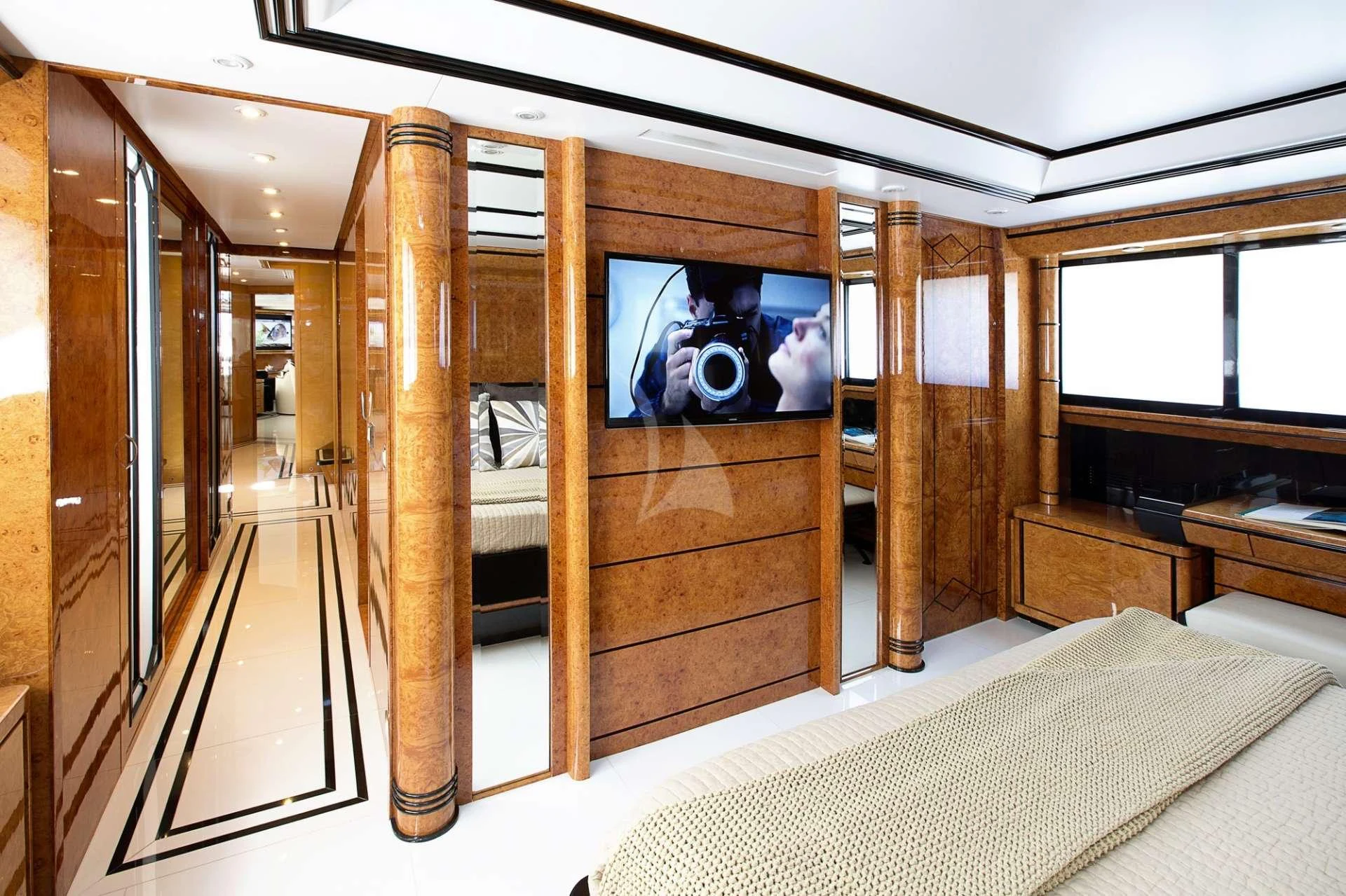a room with a bed and a mirror aboard MILOS AT SEA Yacht for Charter