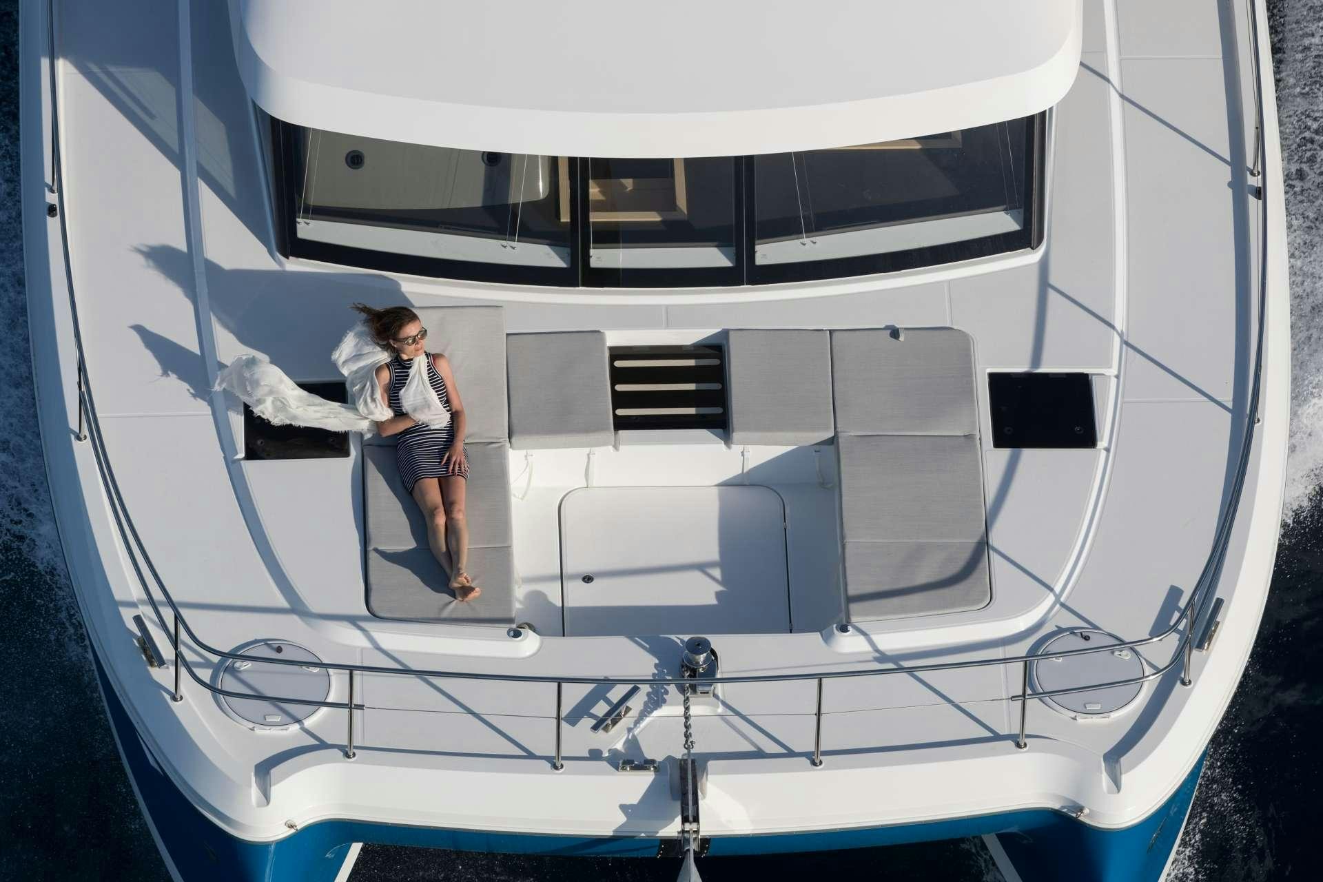 a man and woman standing on a boat aboard ENDLESS BEAUTY Yacht for Charter