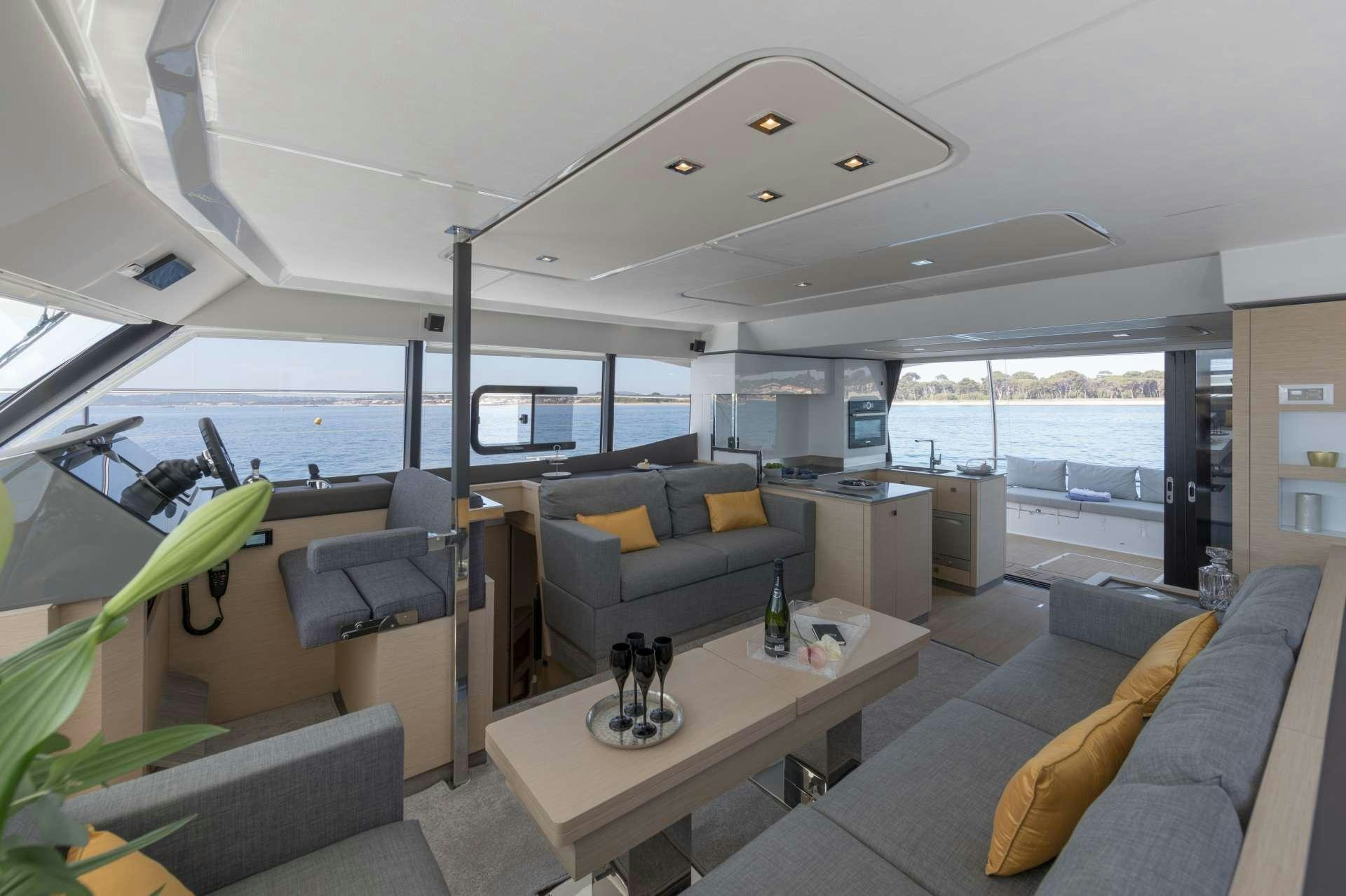 a living room with a large window aboard ENDLESS BEAUTY Yacht for Charter