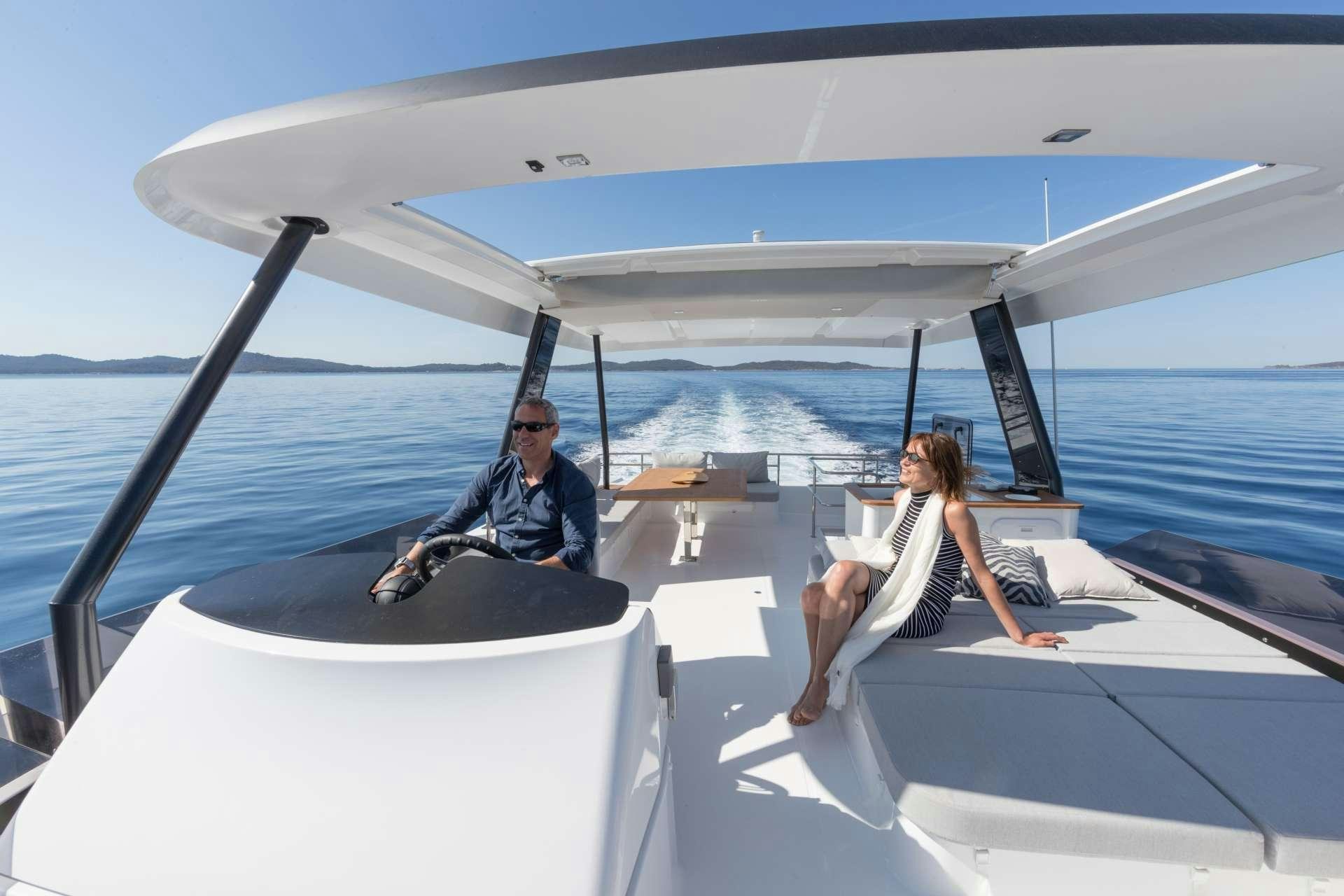 a man and a woman sitting on a boat aboard ENDLESS BEAUTY Yacht for Charter
