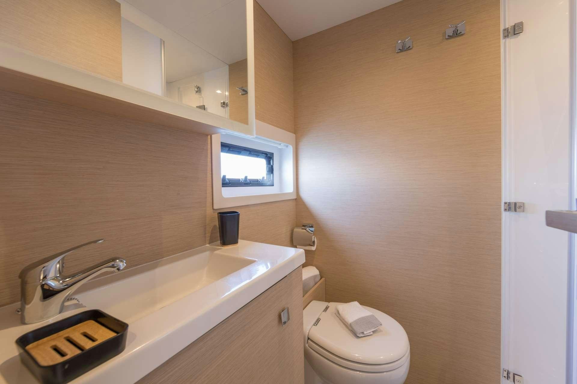 a bathroom with a sink and toilet aboard ENDLESS BEAUTY Yacht for Charter