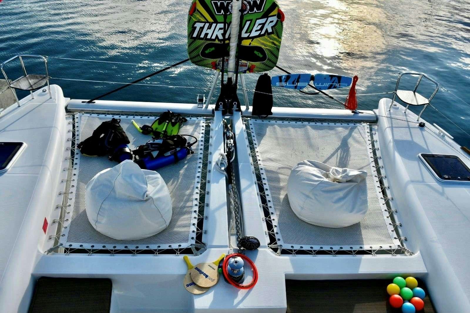 a boat with a bucket and a bucket on the front aboard CHAOS INTERRUPTED Yacht for Charter