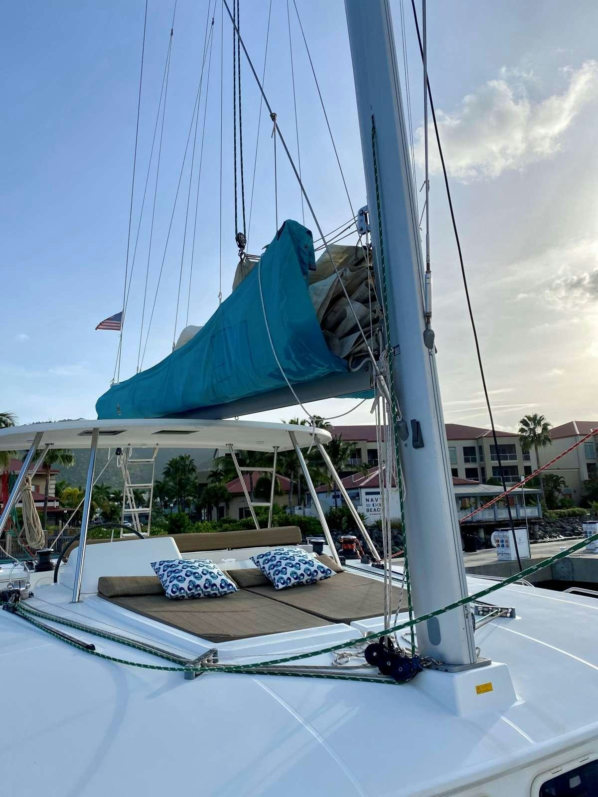 a sailboat on a dock aboard CHAOS INTERRUPTED Yacht for Charter