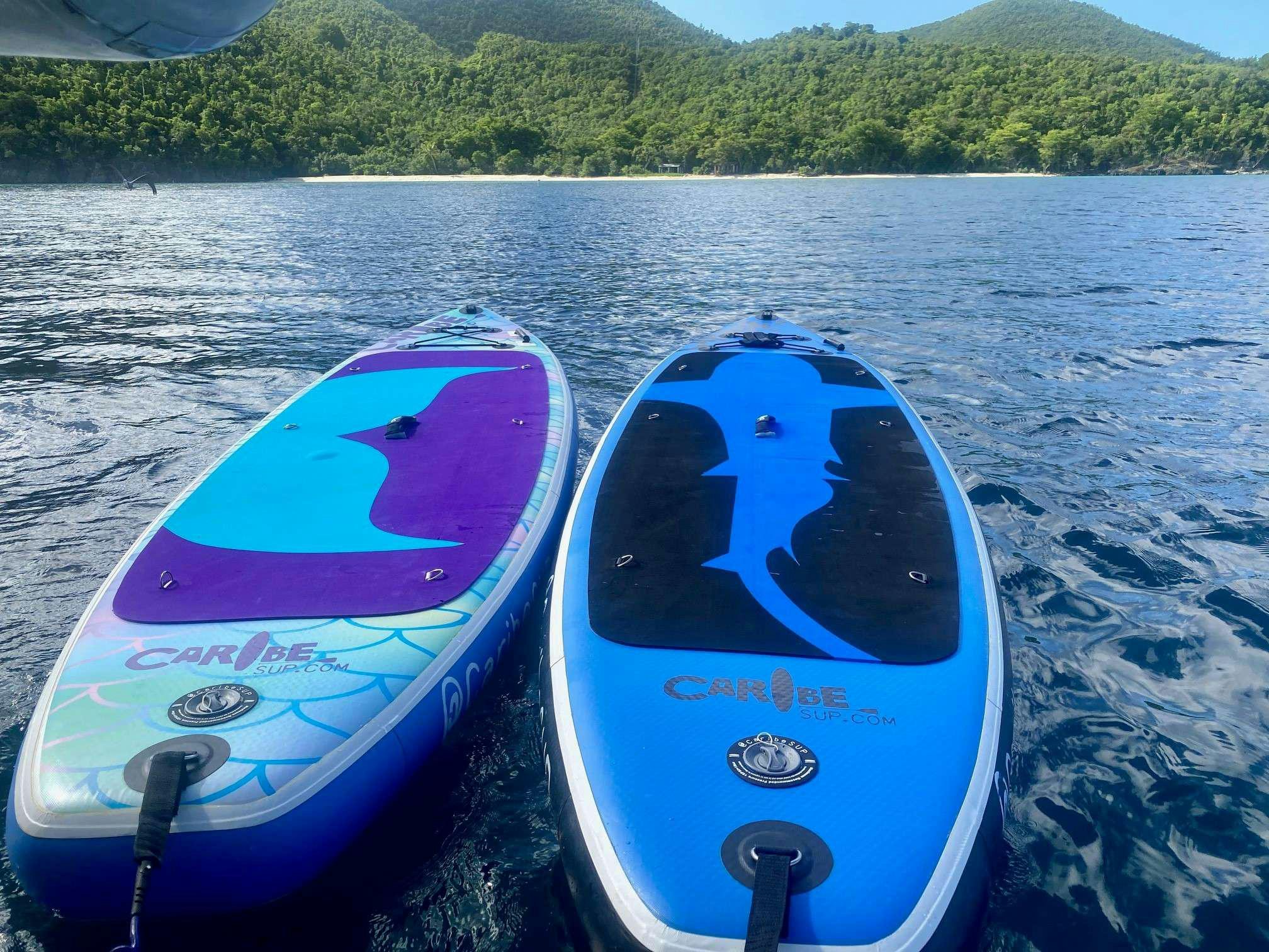 a couple of kayaks on a lake aboard CHAOS INTERRUPTED Yacht for Charter