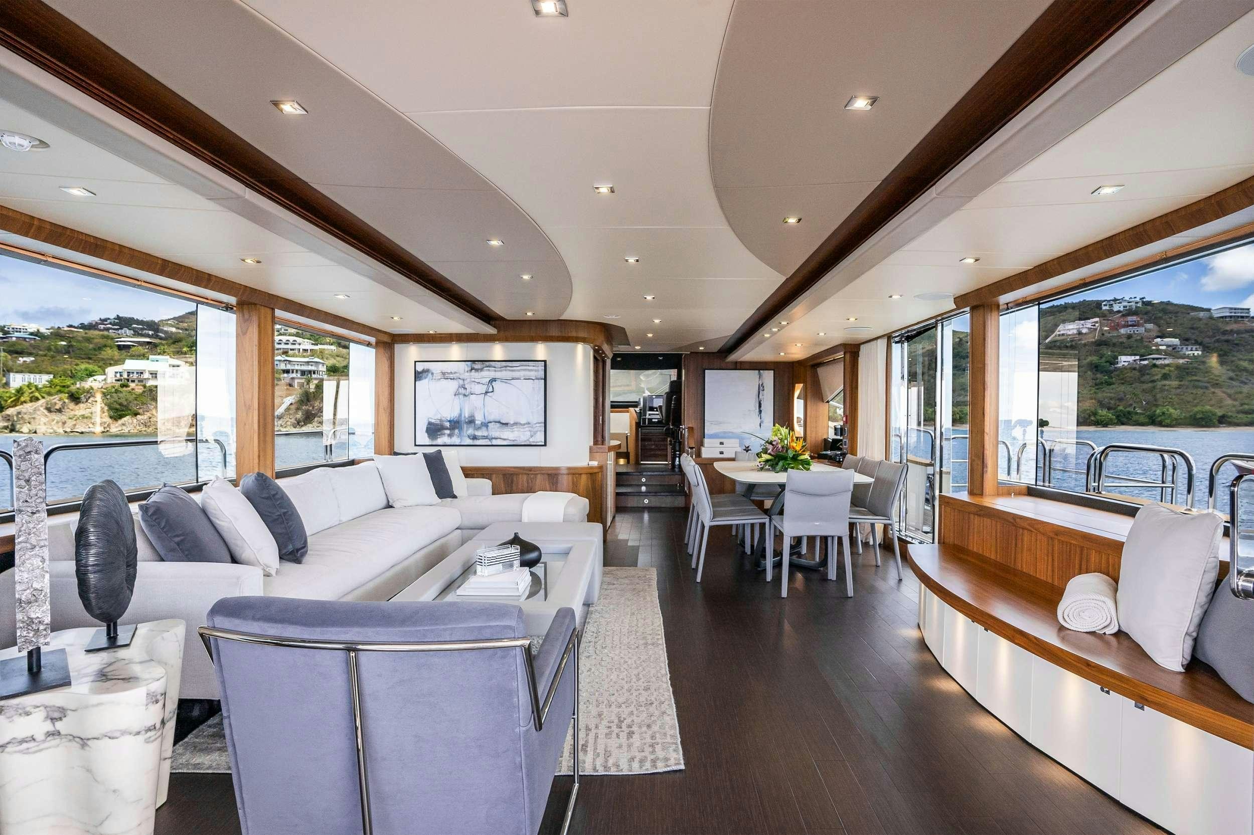 a large living room with a large window aboard ELITE Yacht for Charter