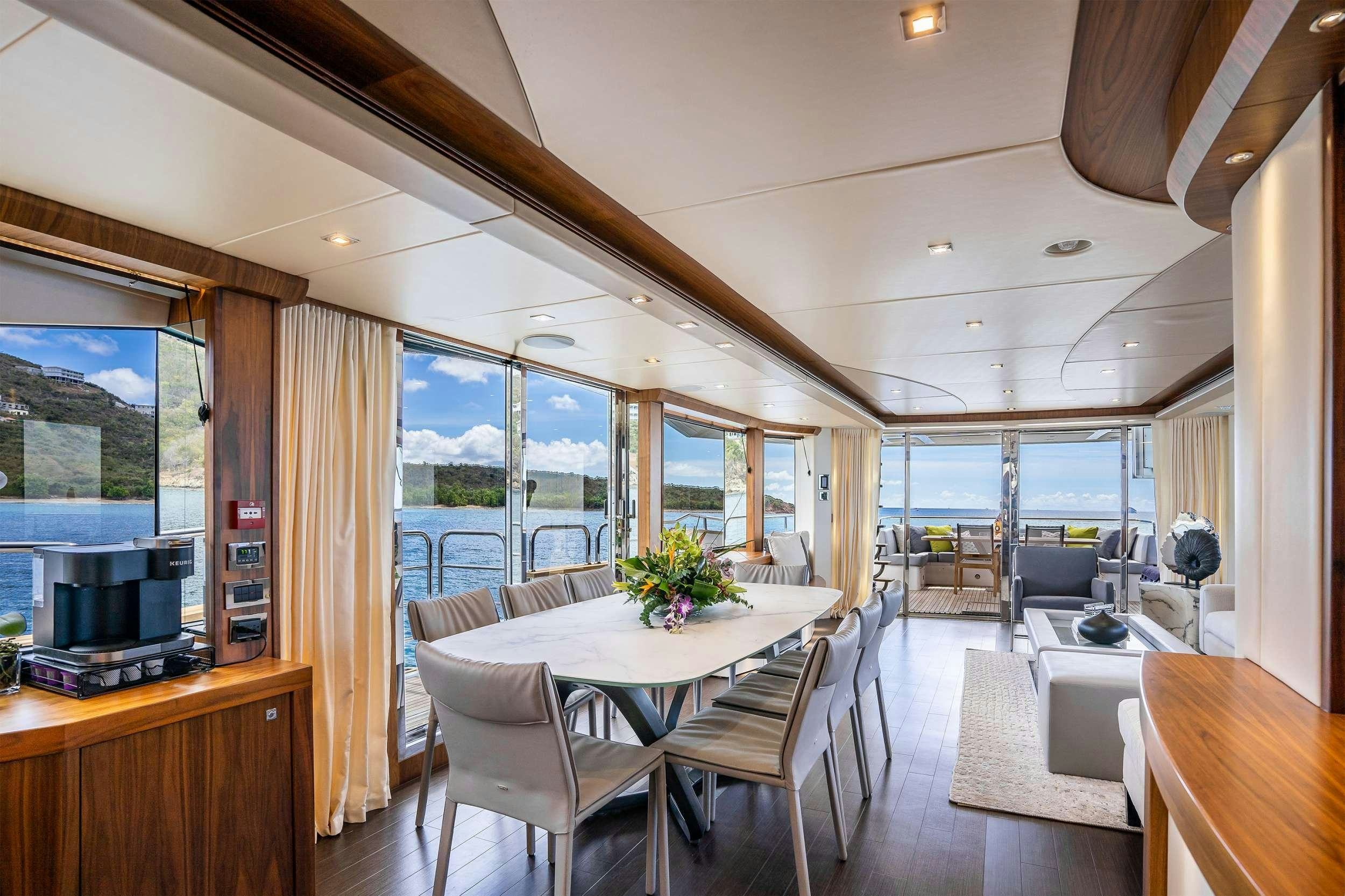 a room with a table and chairs aboard ELITE Yacht for Charter