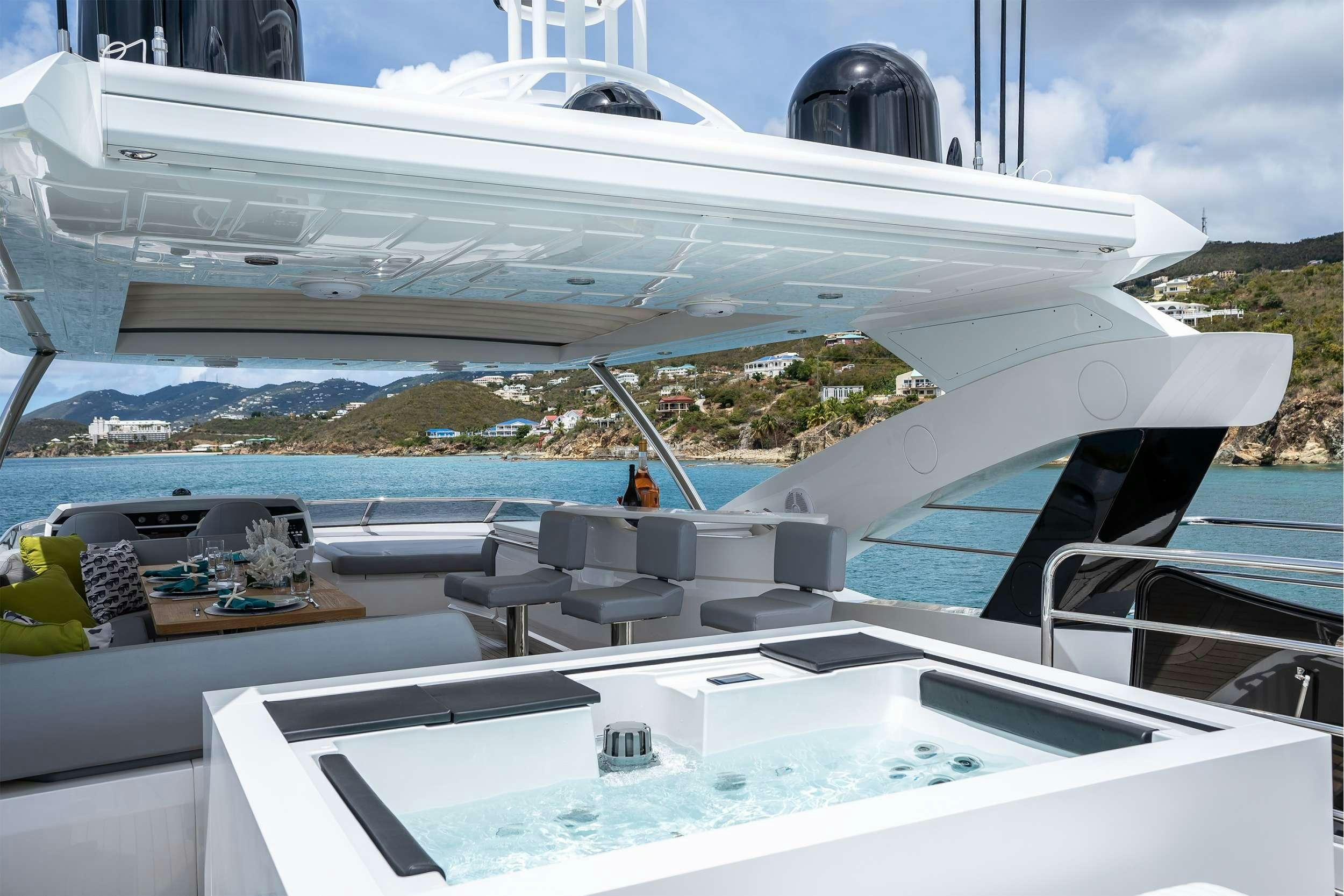 a large white boat with a black roof and a black dome on top aboard ELITE Yacht for Charter