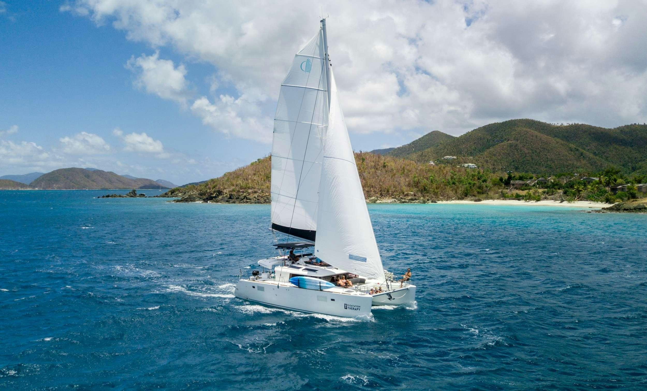 a sailboat on the water aboard FLOATATION THERAPY Yacht for Charter