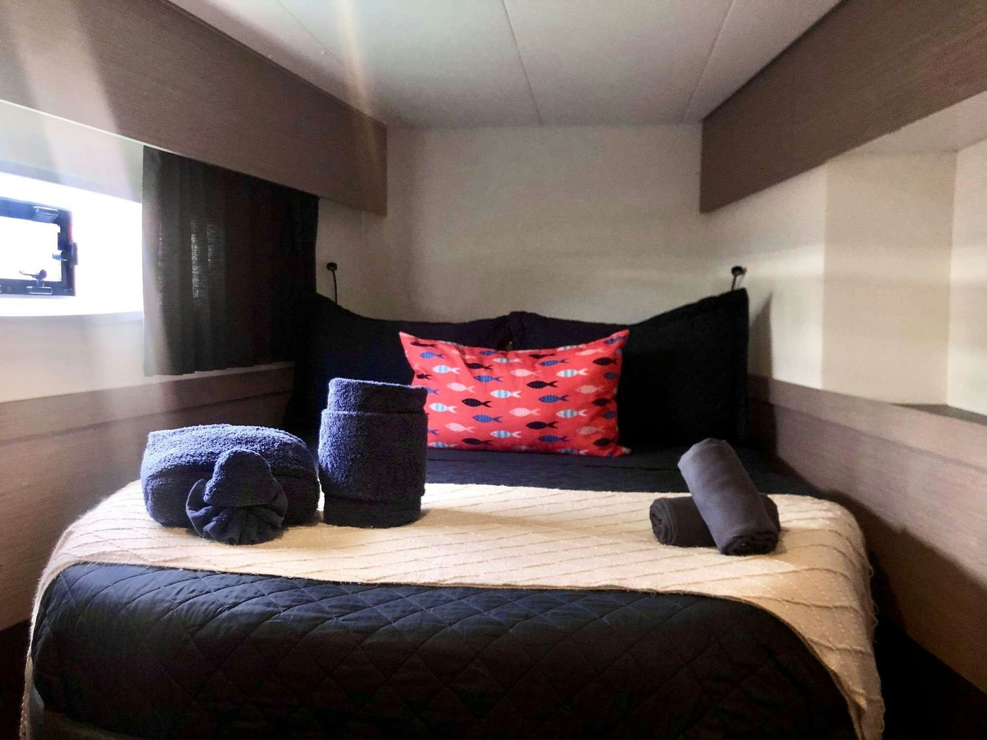 pillows on a bed aboard Ruckus Yacht for Charter