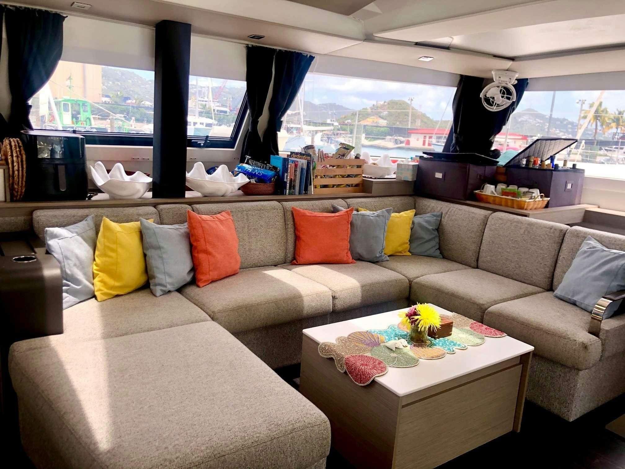 a couch with pillows and pillows aboard Ruckus Yacht for Charter