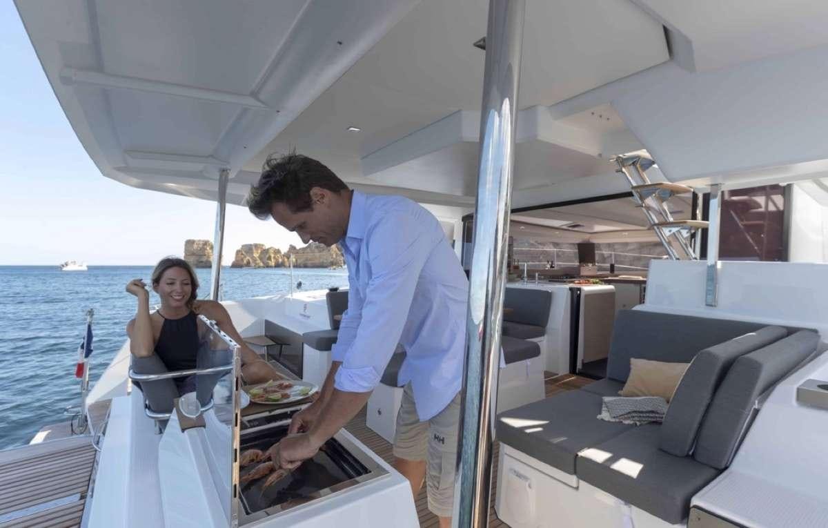 a man and woman on a boat aboard Ruckus Yacht for Charter