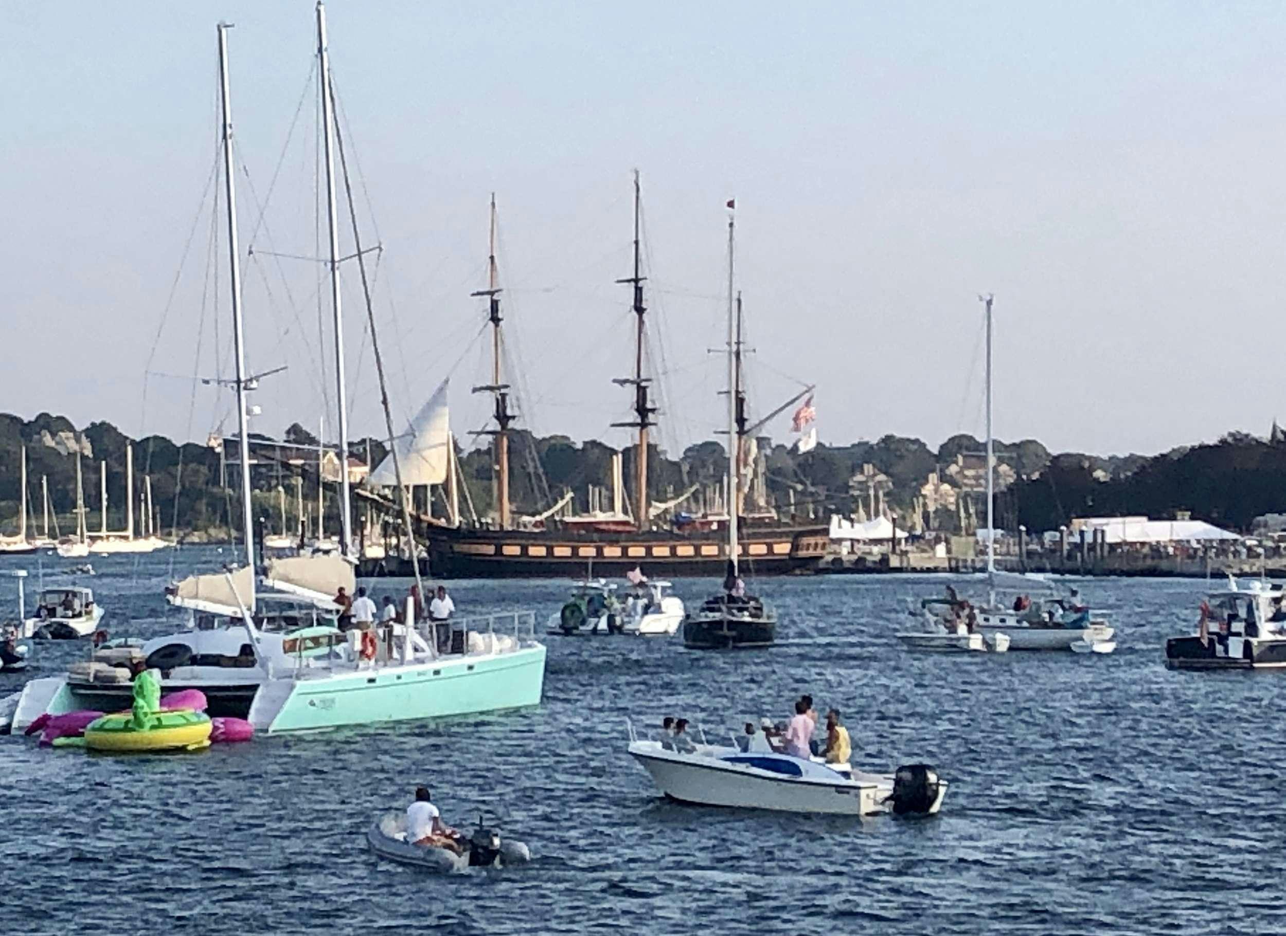 a group of people in a sailboat on the water aboard HERON Yacht for Charter