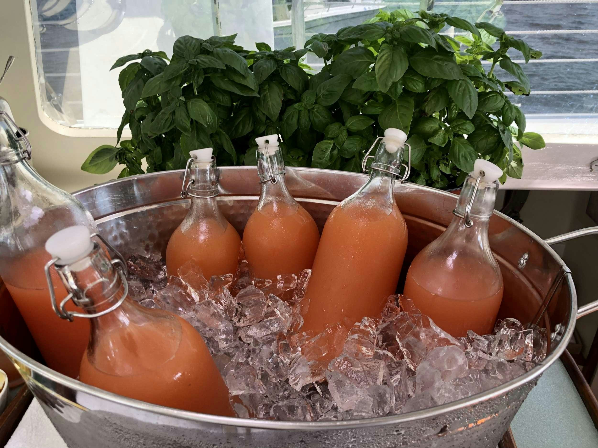 a glass bowl with oranges and other vegetables in it aboard HERON Yacht for Charter
