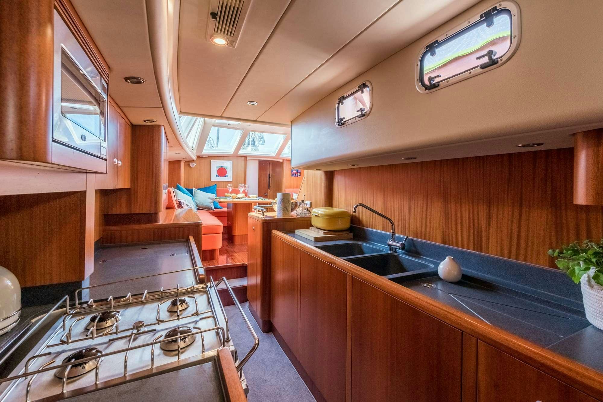 a kitchen with a large island aboard LUNULATA  Yacht for Charter