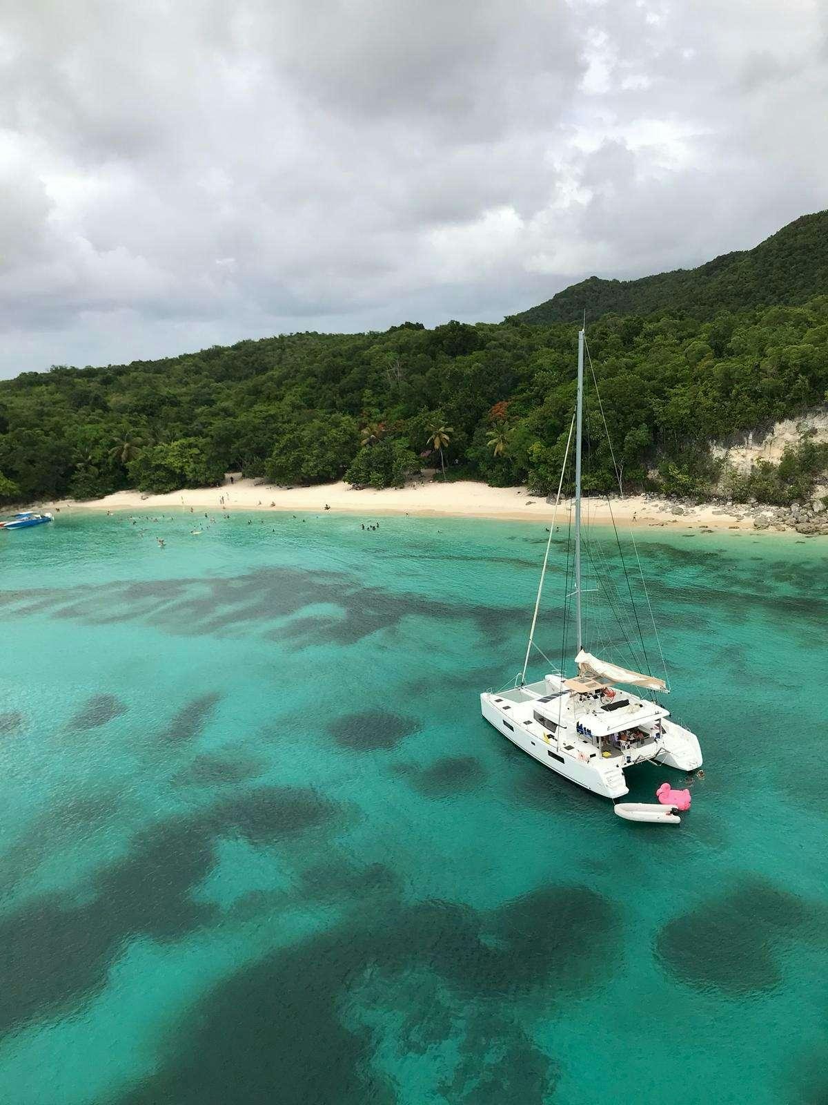 a boat sailing in the water aboard CHAMPAGNE L52 Yacht for Charter