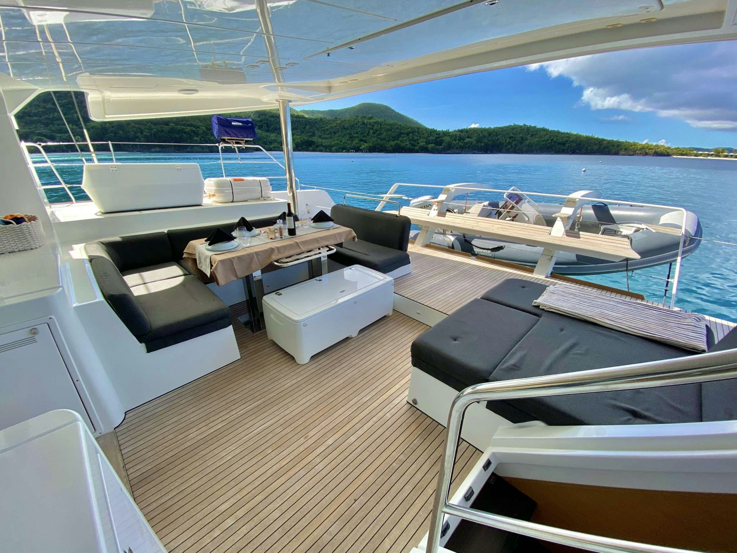 a boat on a deck aboard CHAMPAGNE L52 Yacht for Charter