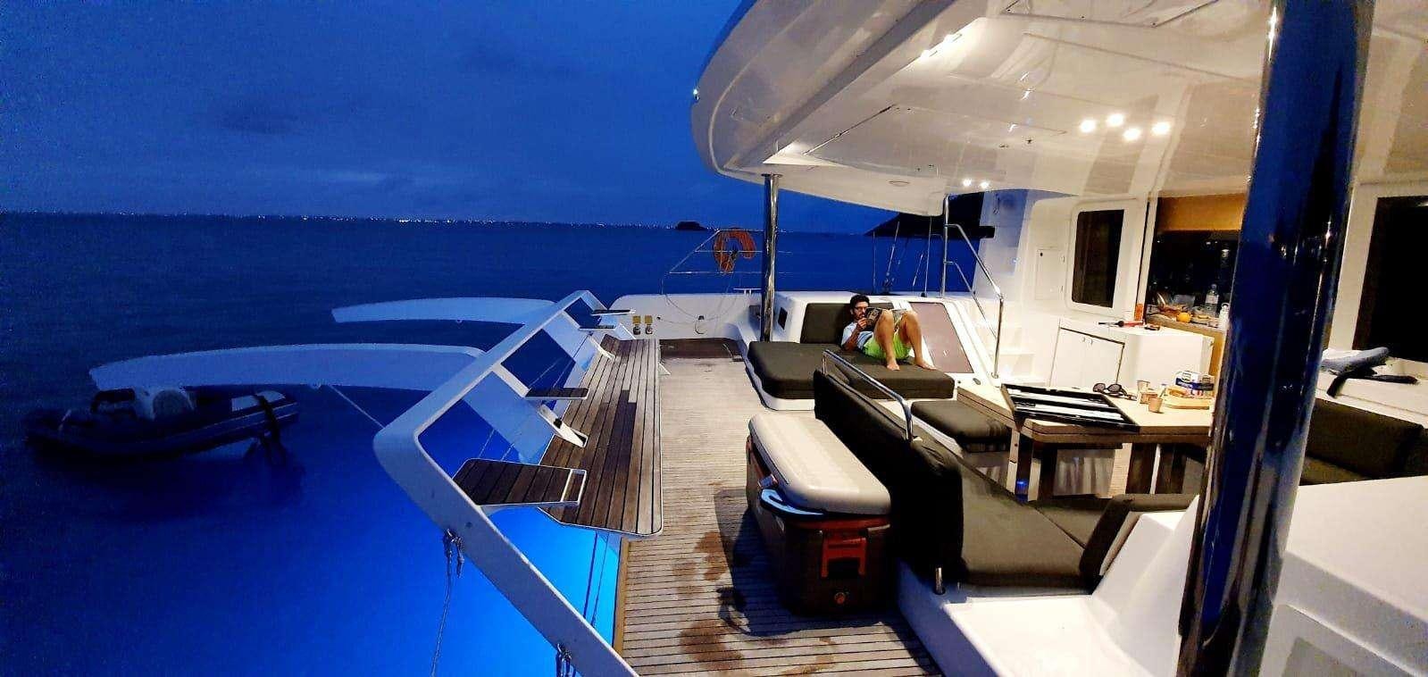 a boat on the water aboard CHAMPAGNE L52 Yacht for Charter