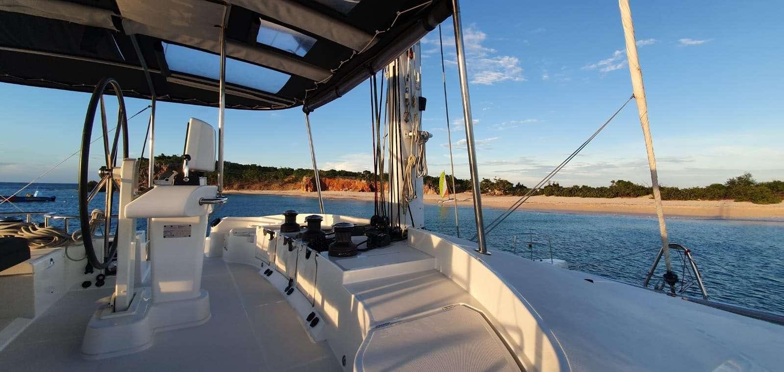 a boat on the water aboard CHAMPAGNE L52 Yacht for Charter