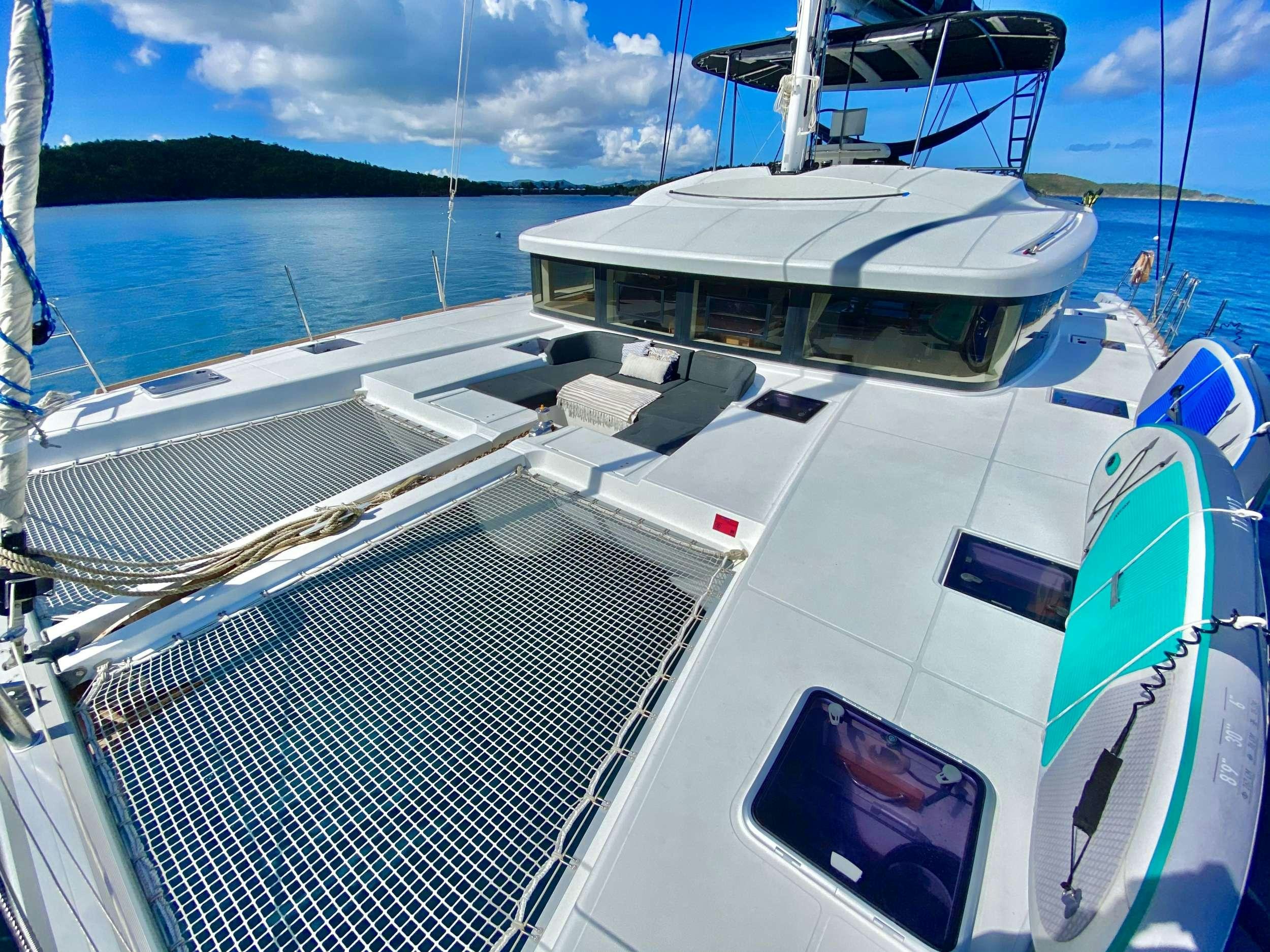 a boat on the water aboard CHAMPAGNE L52 Yacht for Charter