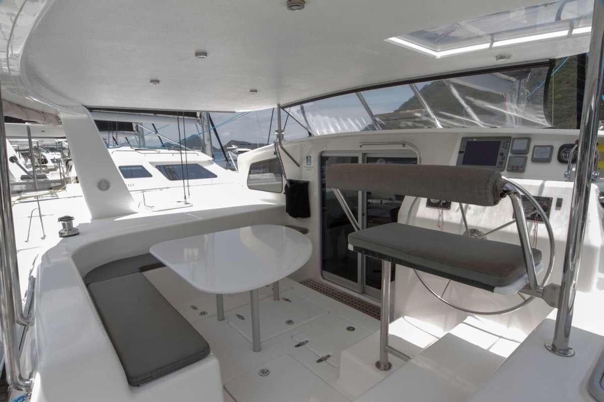 a room with a table and chairs aboard PURPLE PELICAN Yacht for Charter