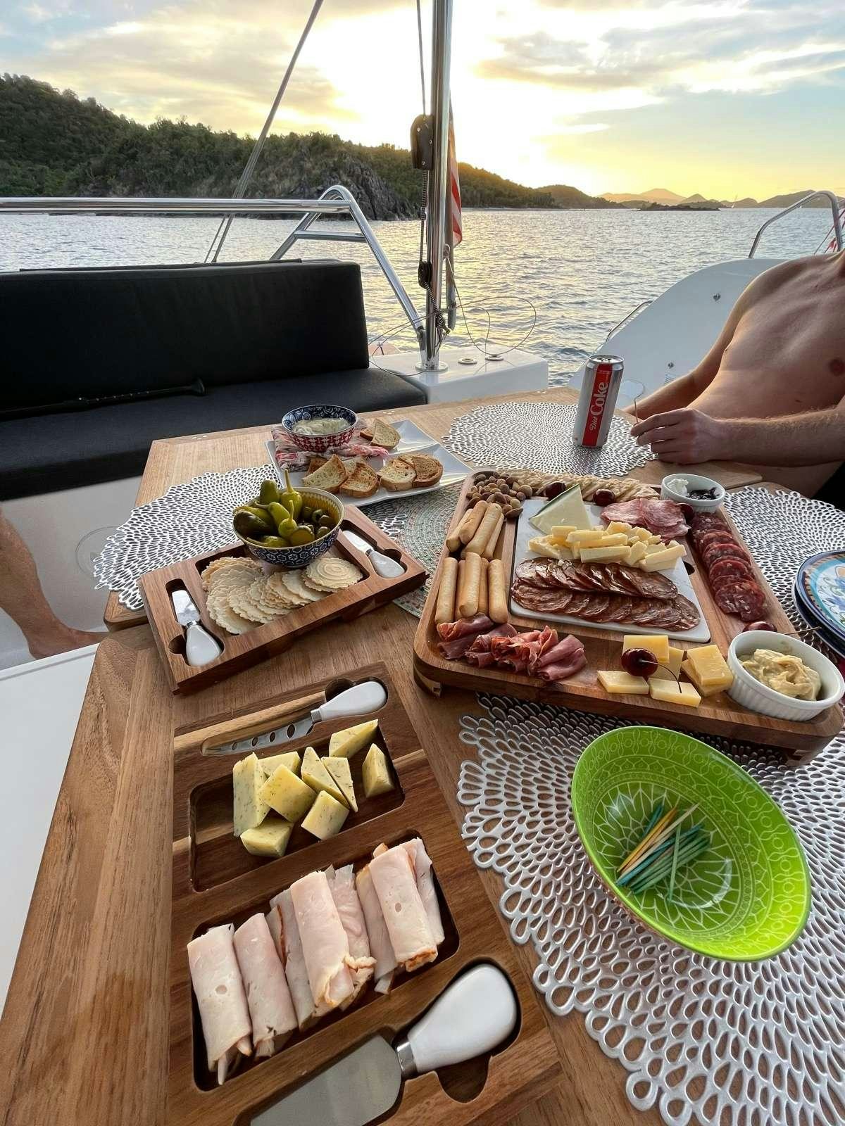 a table with food on it aboard CELAVIE Yacht for Charter