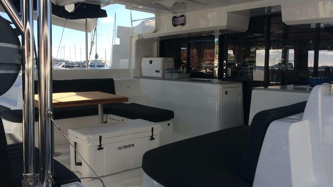 a room with a desk and a printer aboard CELAVIE Yacht for Charter