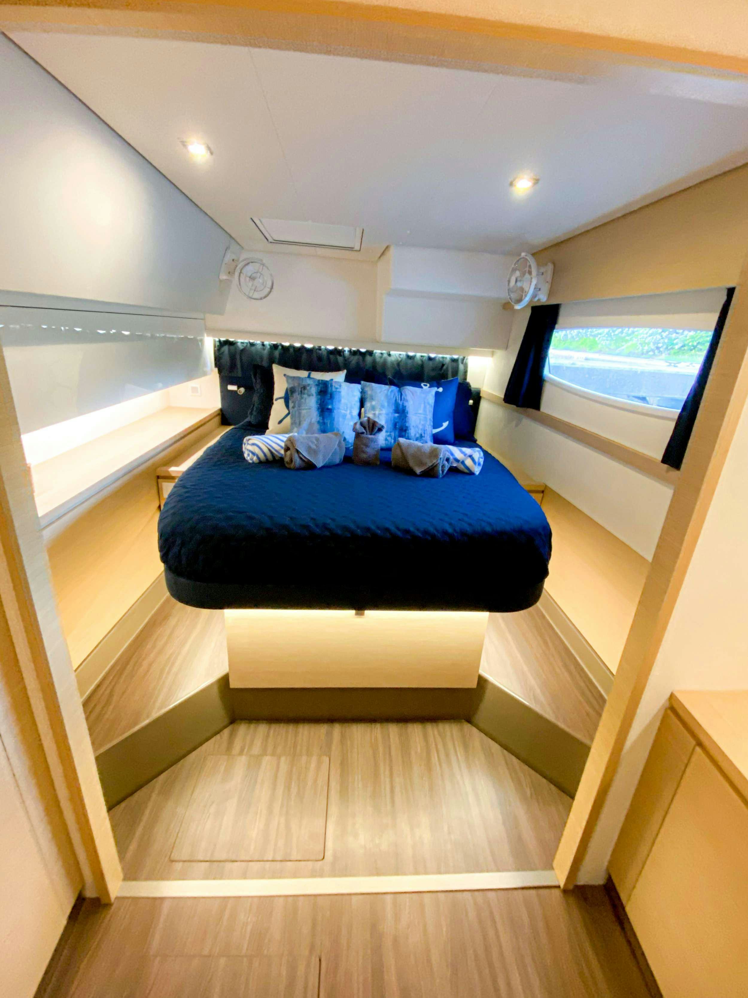 a bed in a room aboard Sol Mates Yacht for Charter