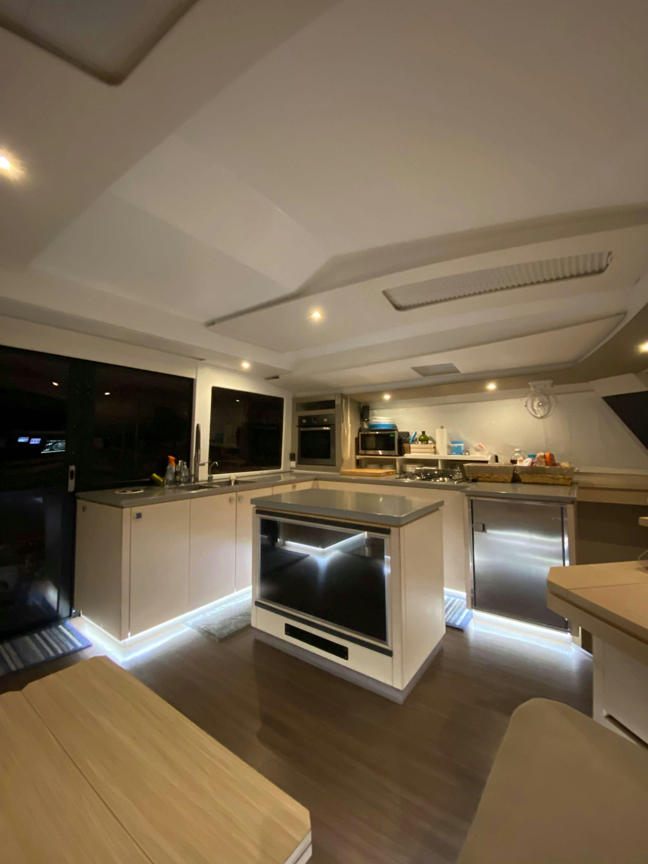 a kitchen with a large oven aboard Sol Mates Yacht for Charter