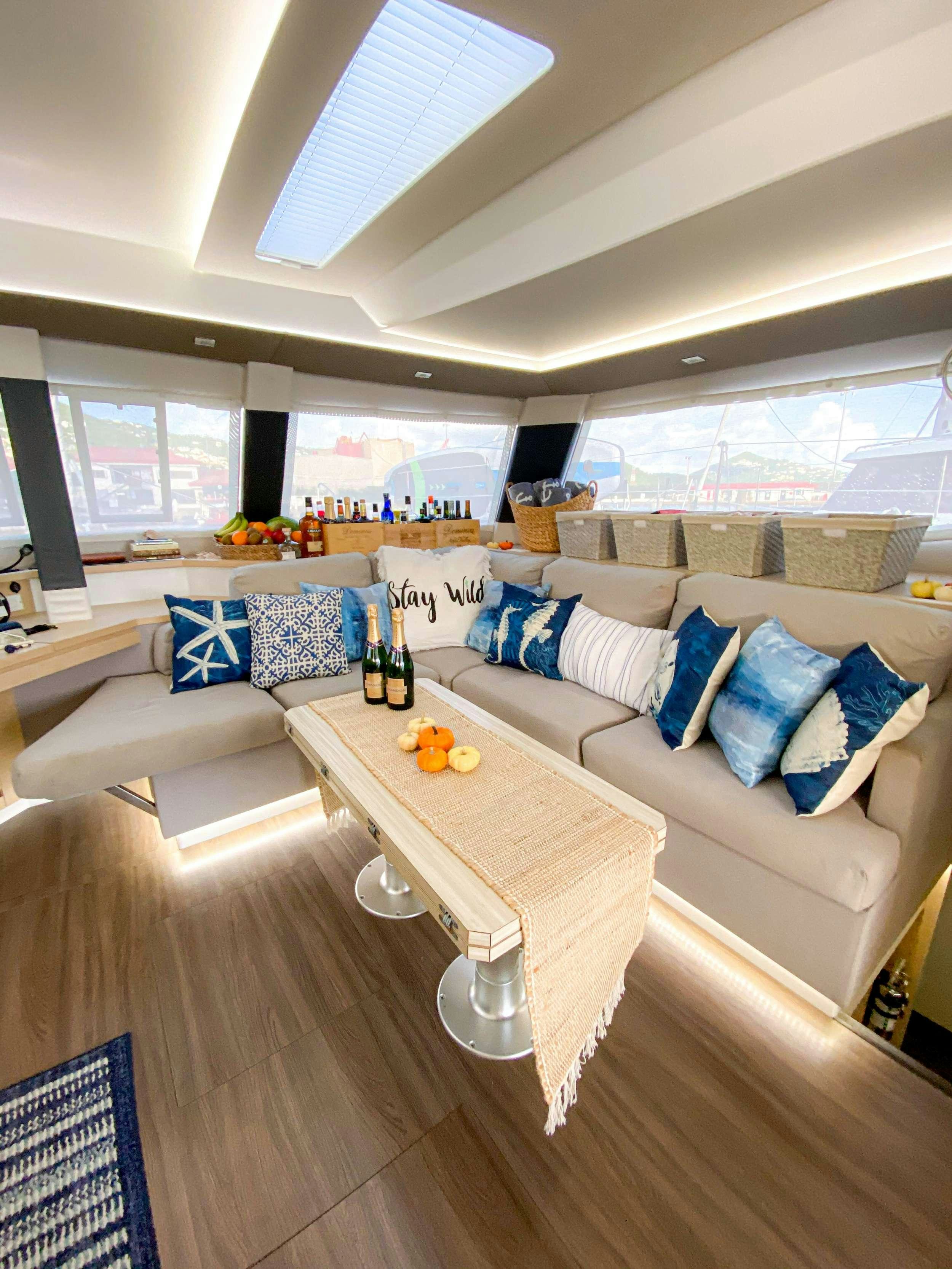 a living room with a couch and a table aboard Sol Mates Yacht for Charter