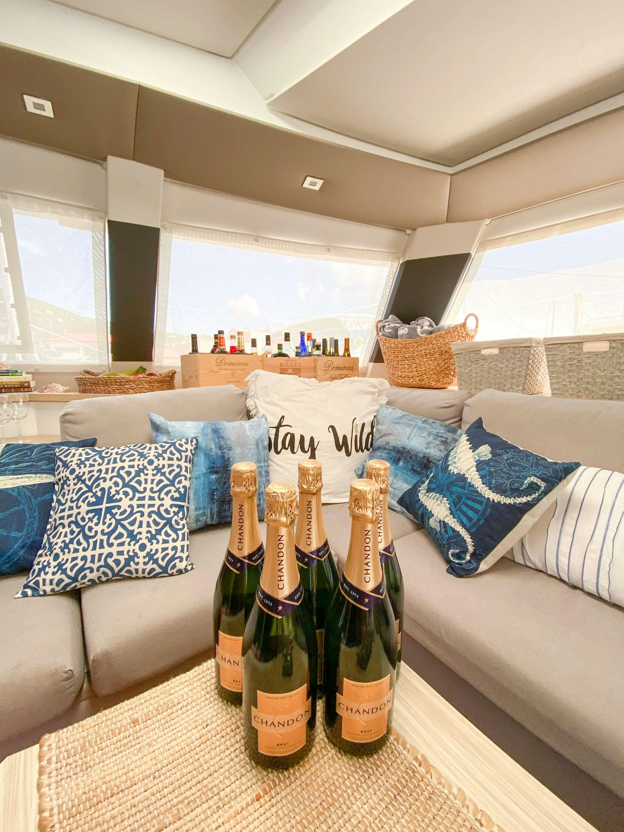 a group of bottles on a table aboard Sol Mates Yacht for Charter